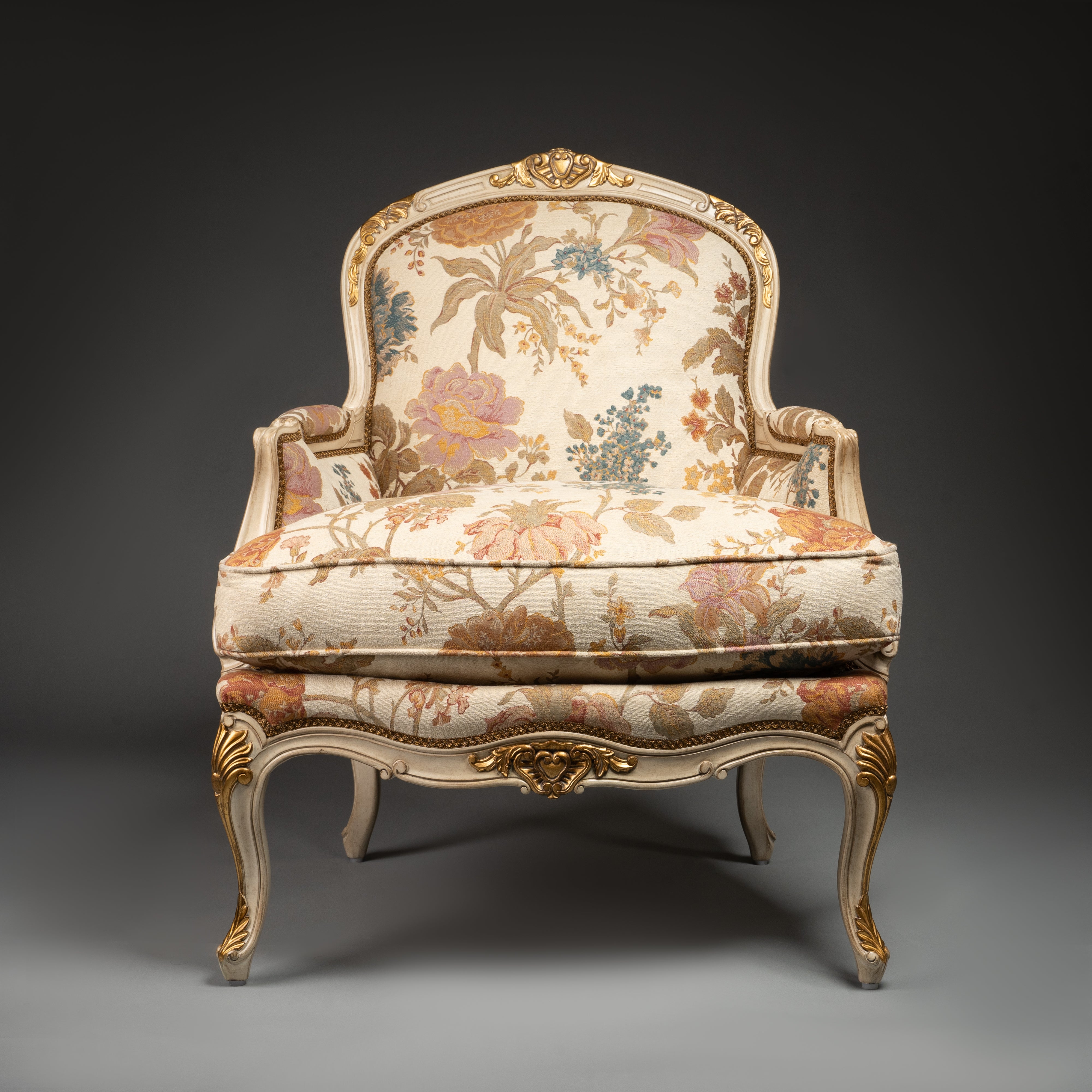 Louis XV-Style Bergère Armchair with Floral Upholstery and Gilded Accents