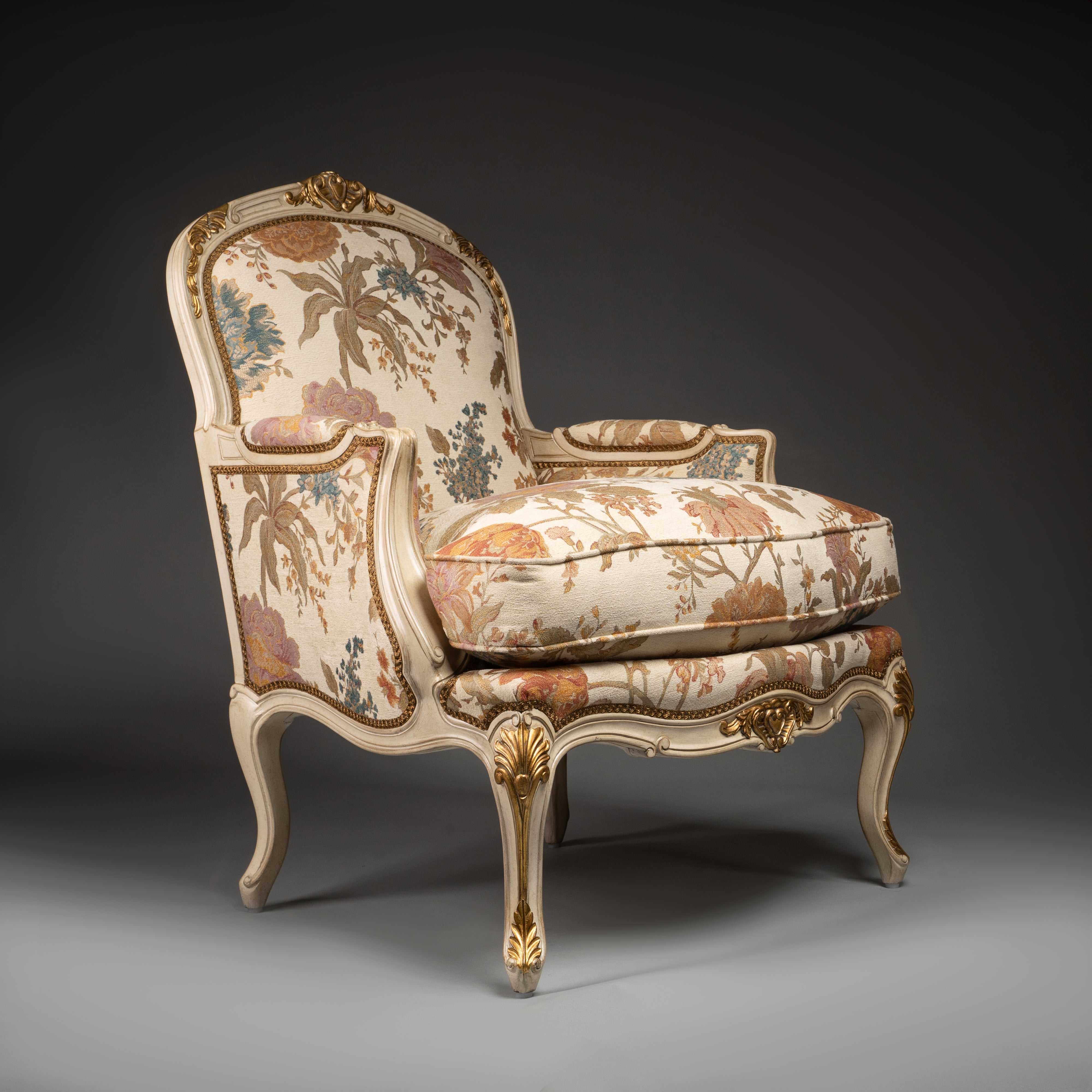 Louis XV-Style Bergère Armchair with Floral Upholstery and Gilded Accents