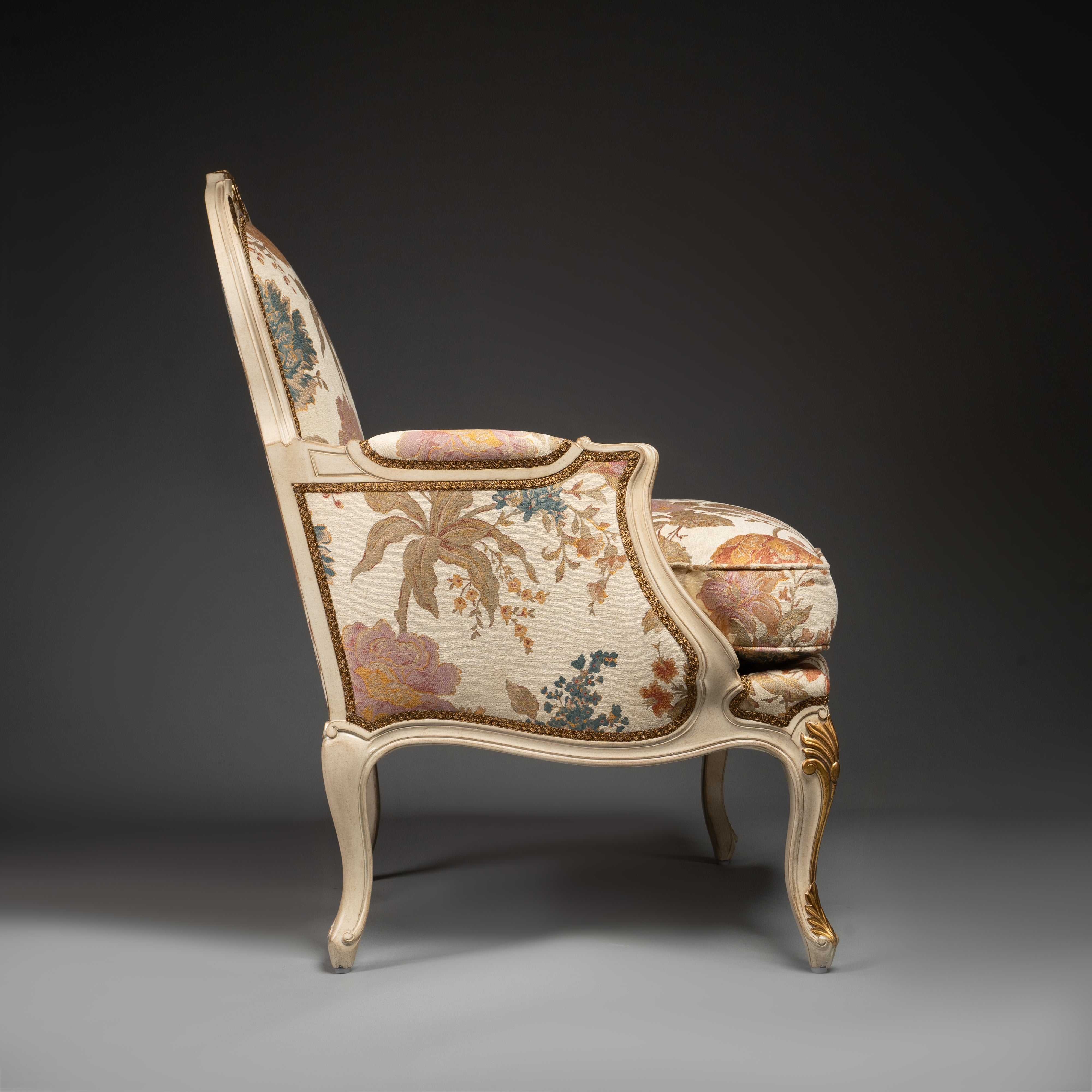 Louis XV-Style Bergère Armchair with Floral Upholstery and Gilded Accents