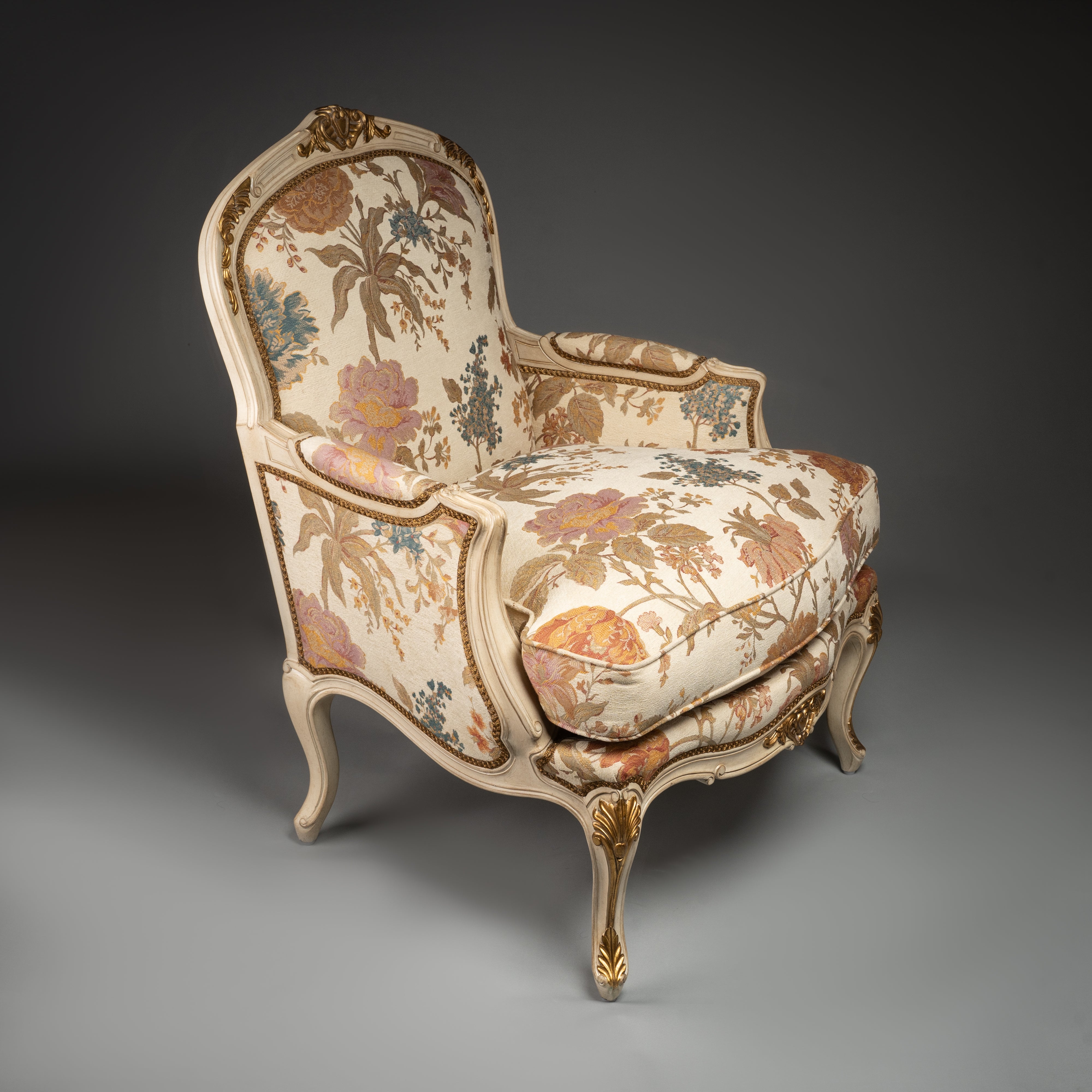 Louis XV-Style Bergère Armchair with Floral Upholstery and Gilded Accents