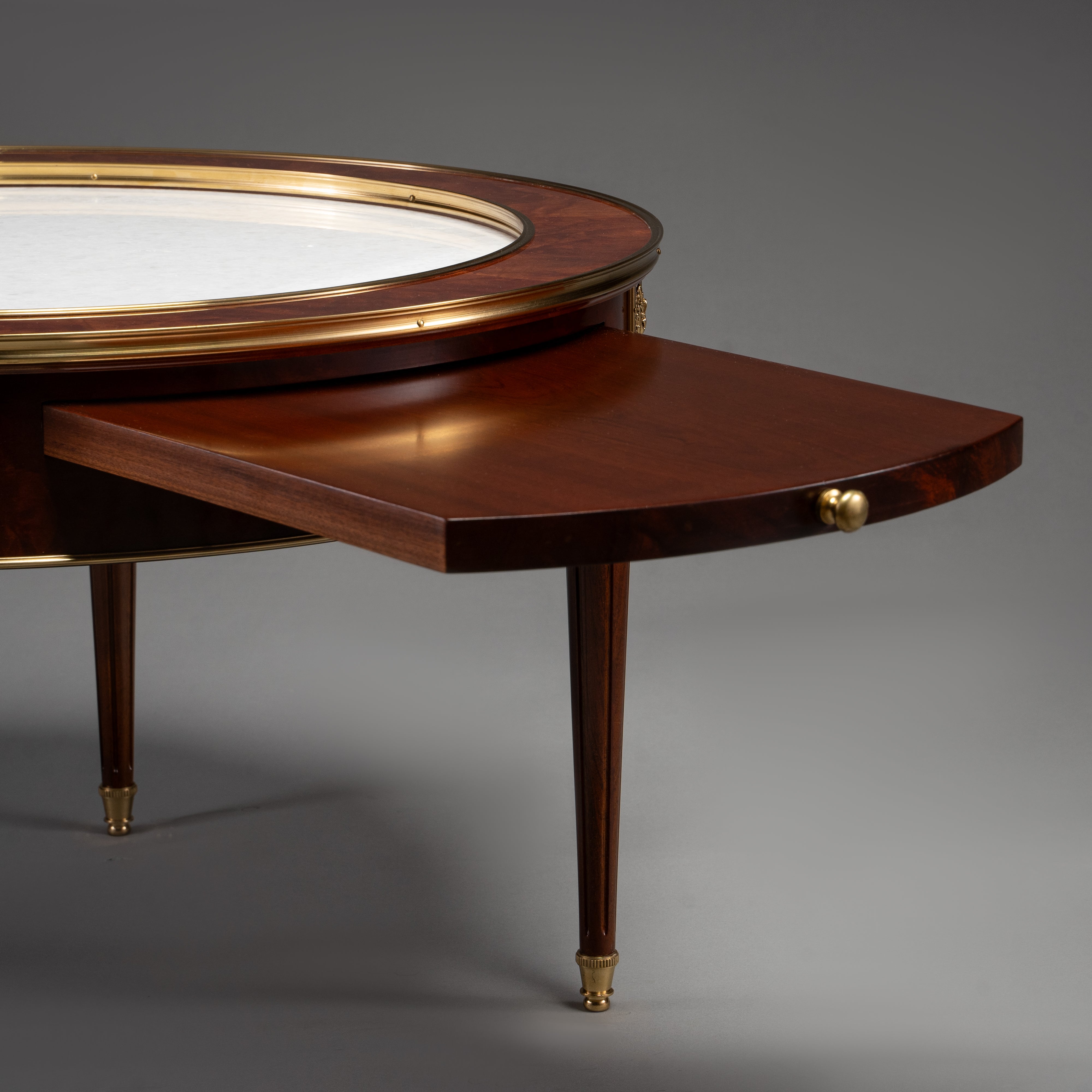 Empire Style Circular Mahogany Table with Brass Trim and Hidden Drawer