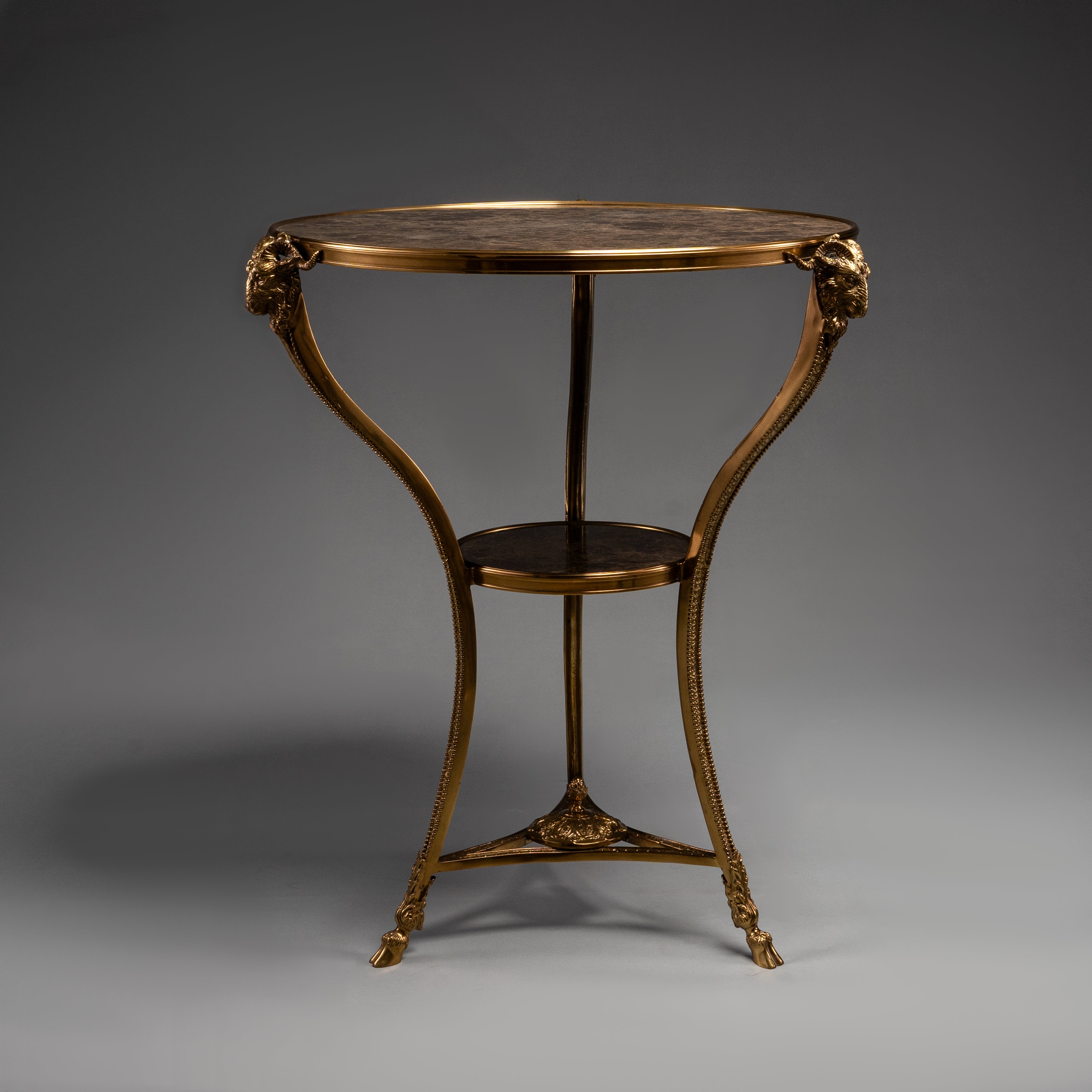Elegant Round Side Table with Marble Top and Brass Ram Head Motifs