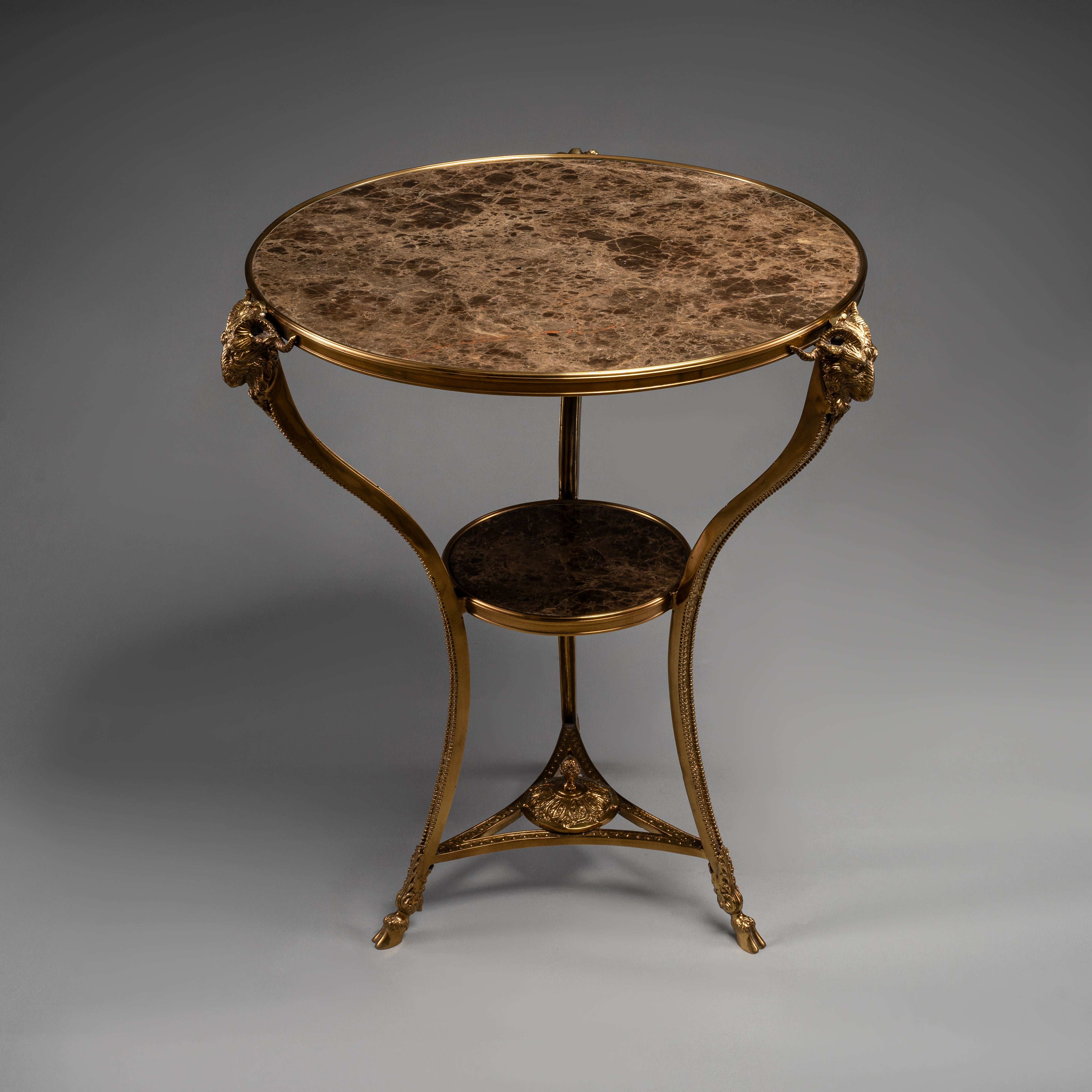 Elegant Round Side Table with Marble Top and Brass Ram Head Motifs