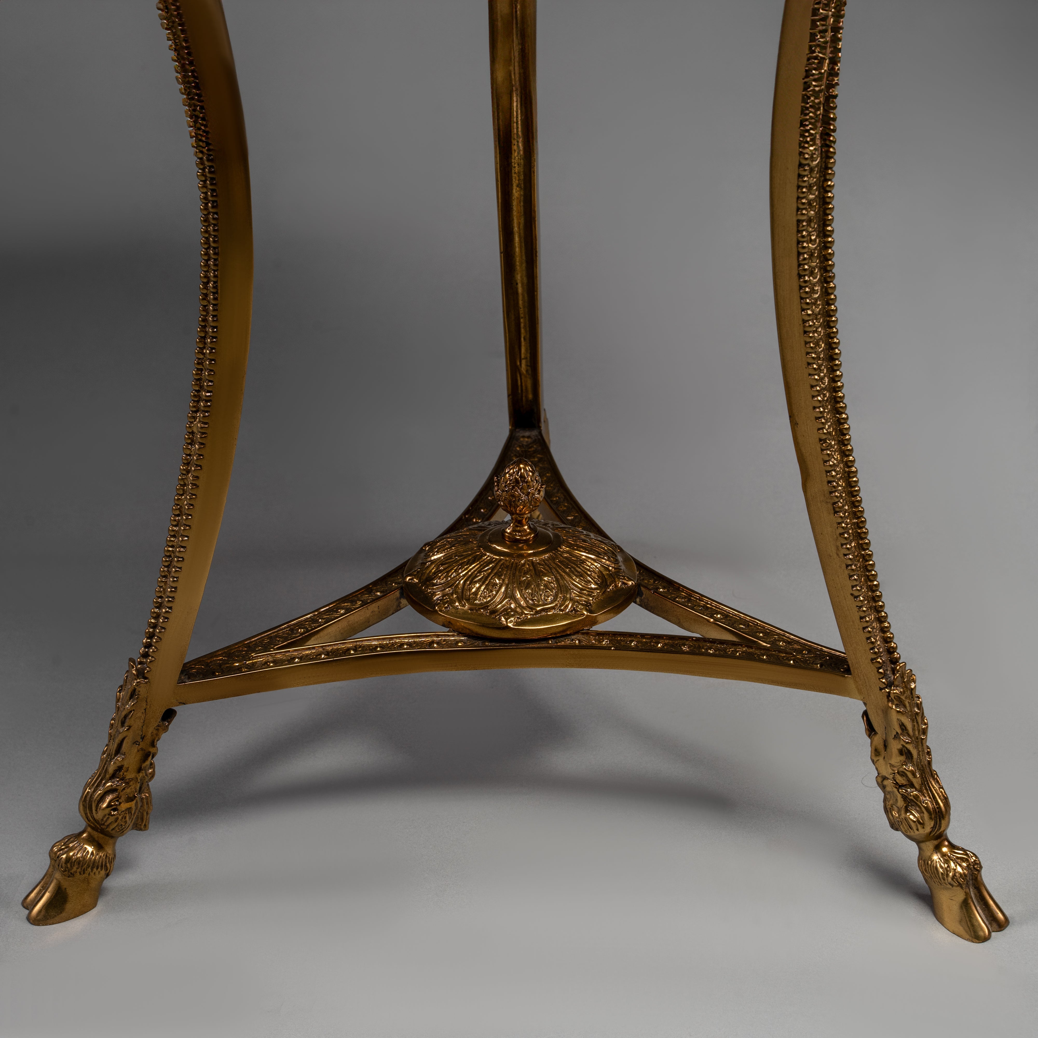 Elegant Round Side Table with Marble Top and Brass Ram Head Motifs