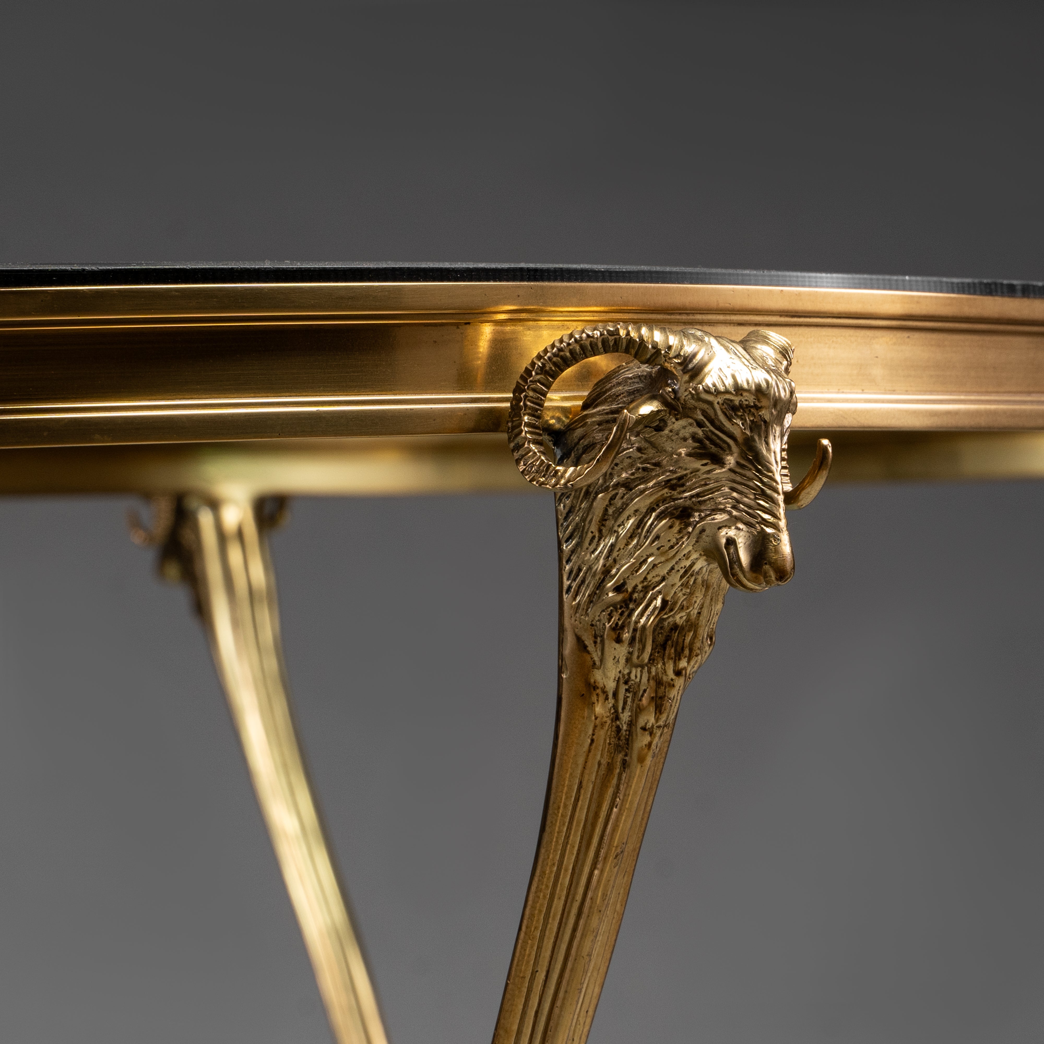 Oval Brass Coffee Table with Glass Shelves and Ram Head Accents
