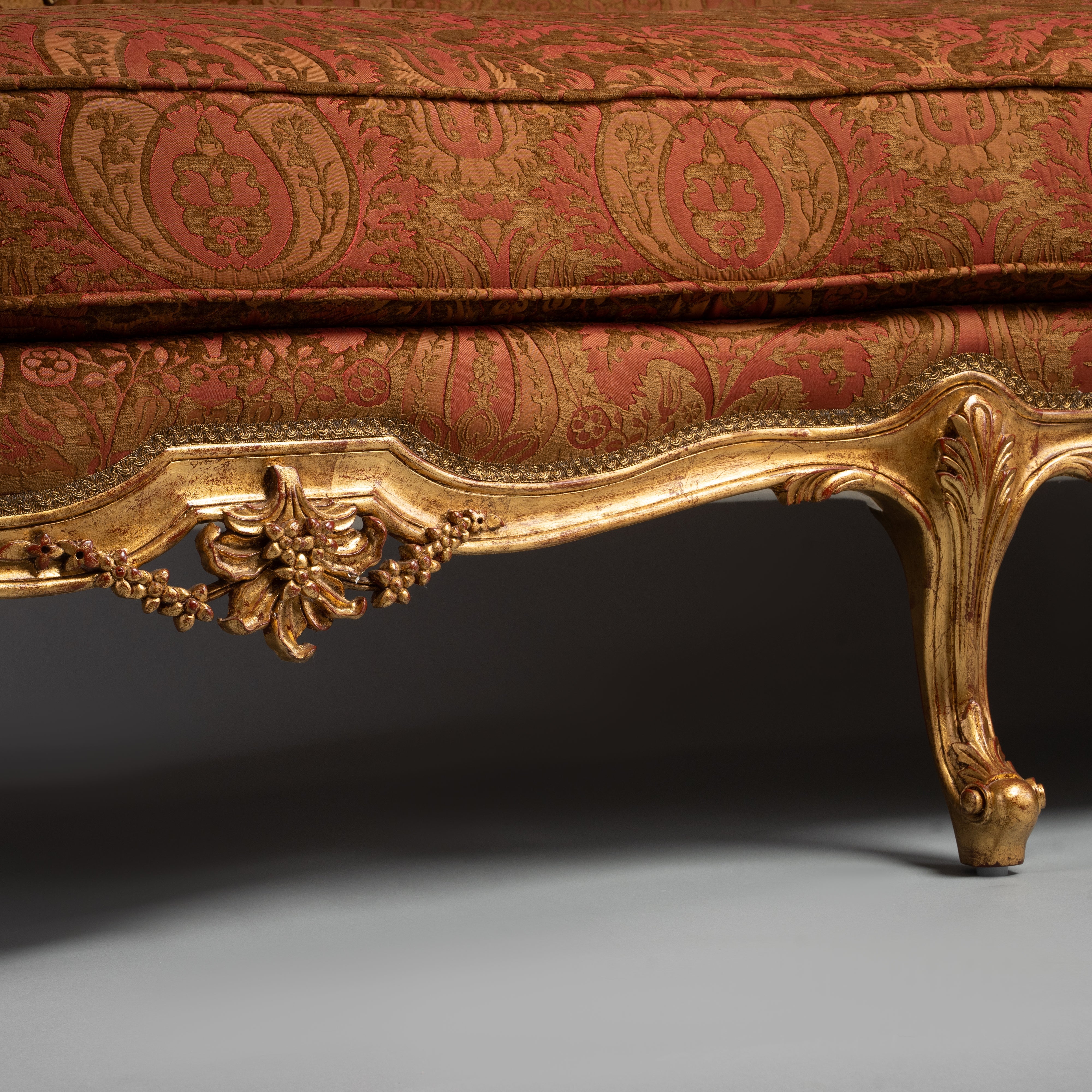Luxurious Louis XV-Style Sofa with Ornate Gilded Frame and Red Brocade Upholstery
