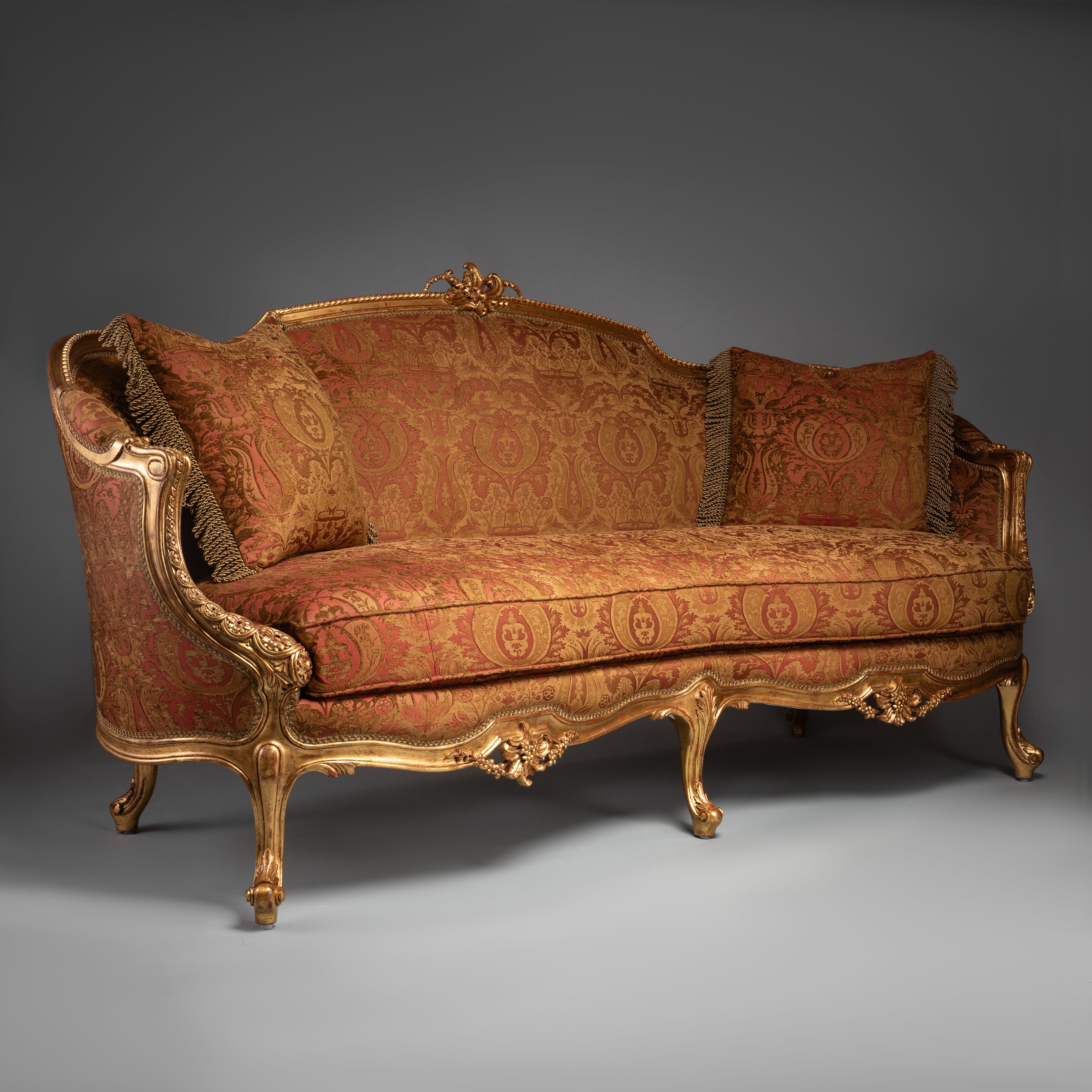 Luxurious Louis XV-Style Sofa with Ornate Gilded Frame and Red Brocade Upholstery