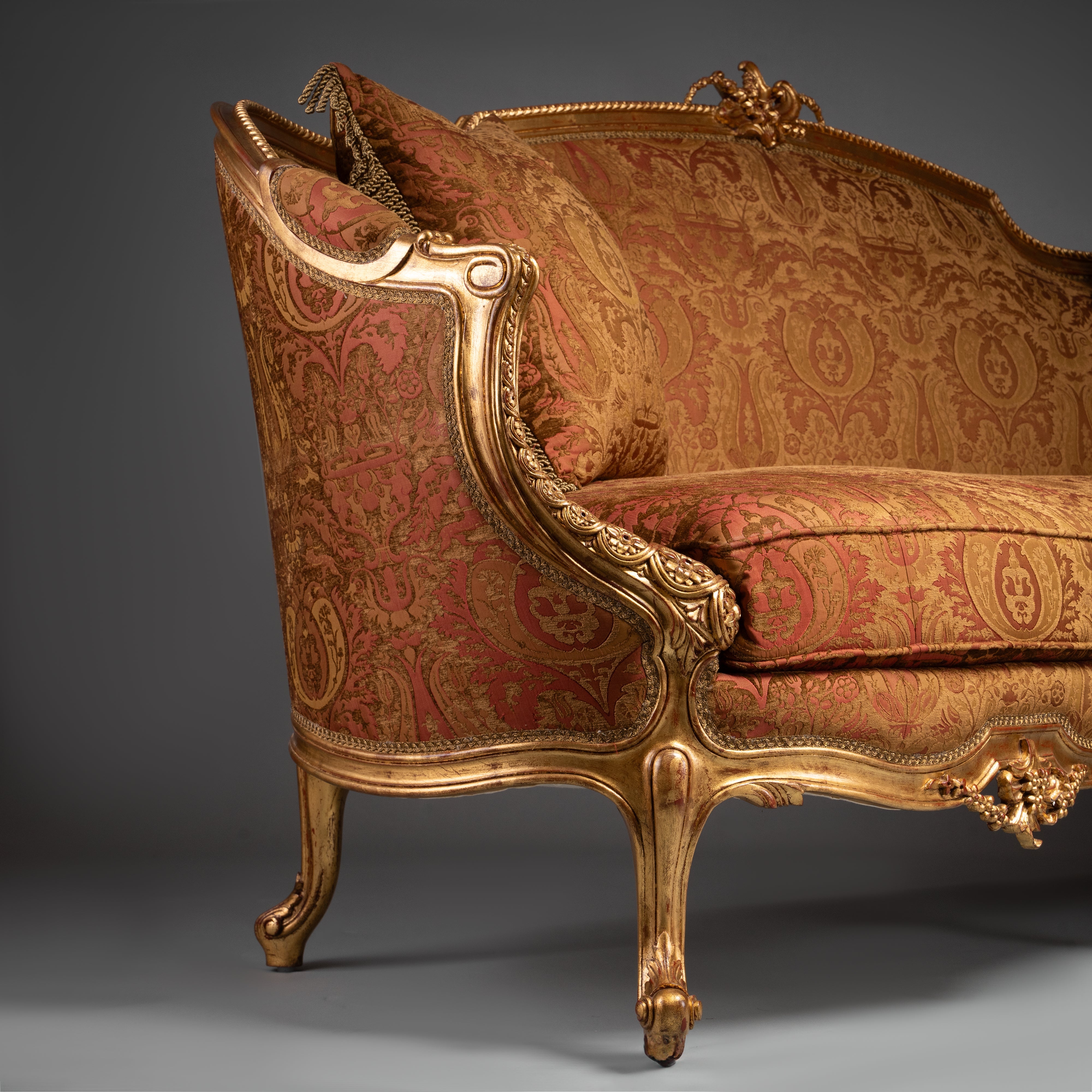 Luxurious Louis XV-Style Sofa with Ornate Gilded Frame and Red Brocade Upholstery