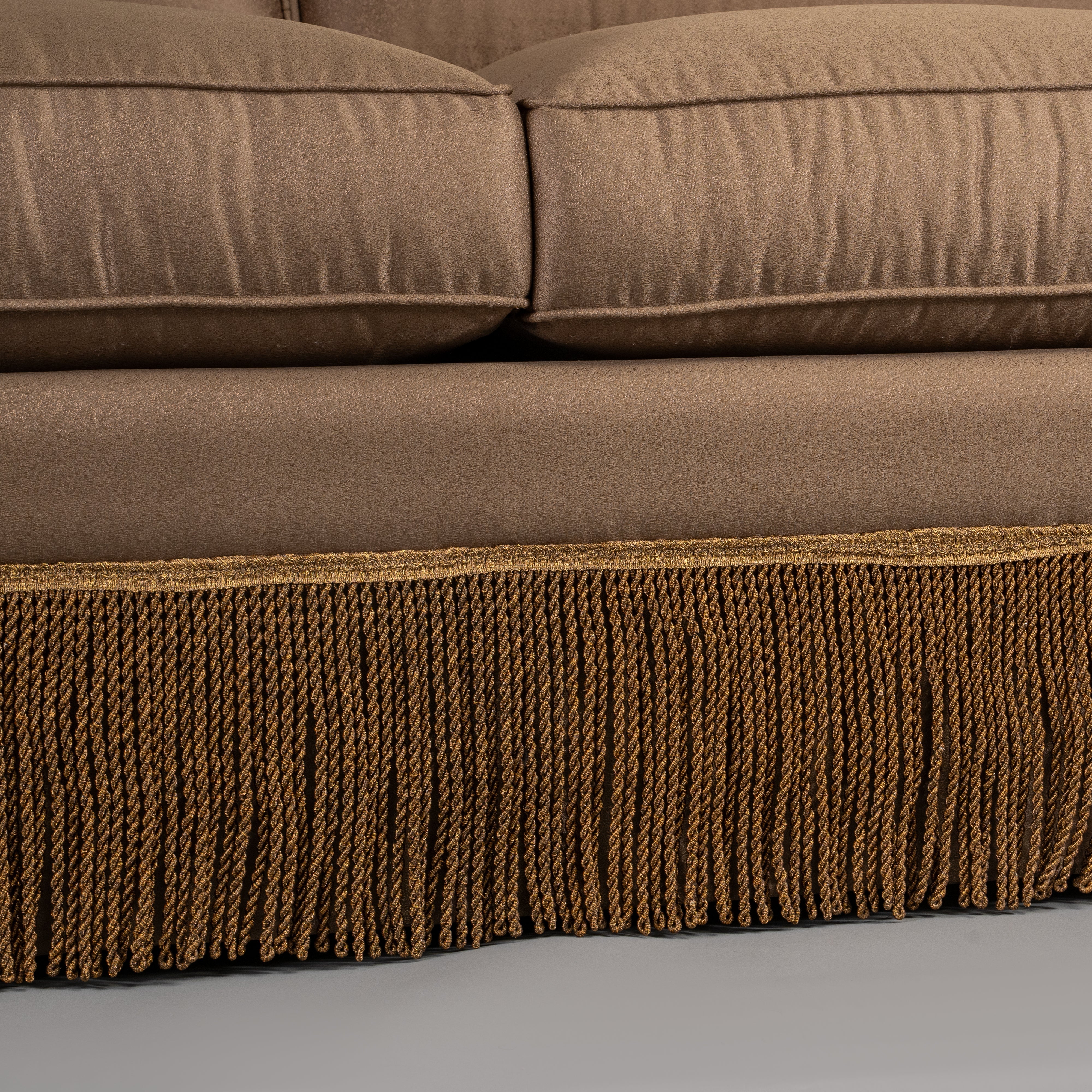 Classic Taupe Sofa with Rolled Arms and Decorative Fringe Skirt