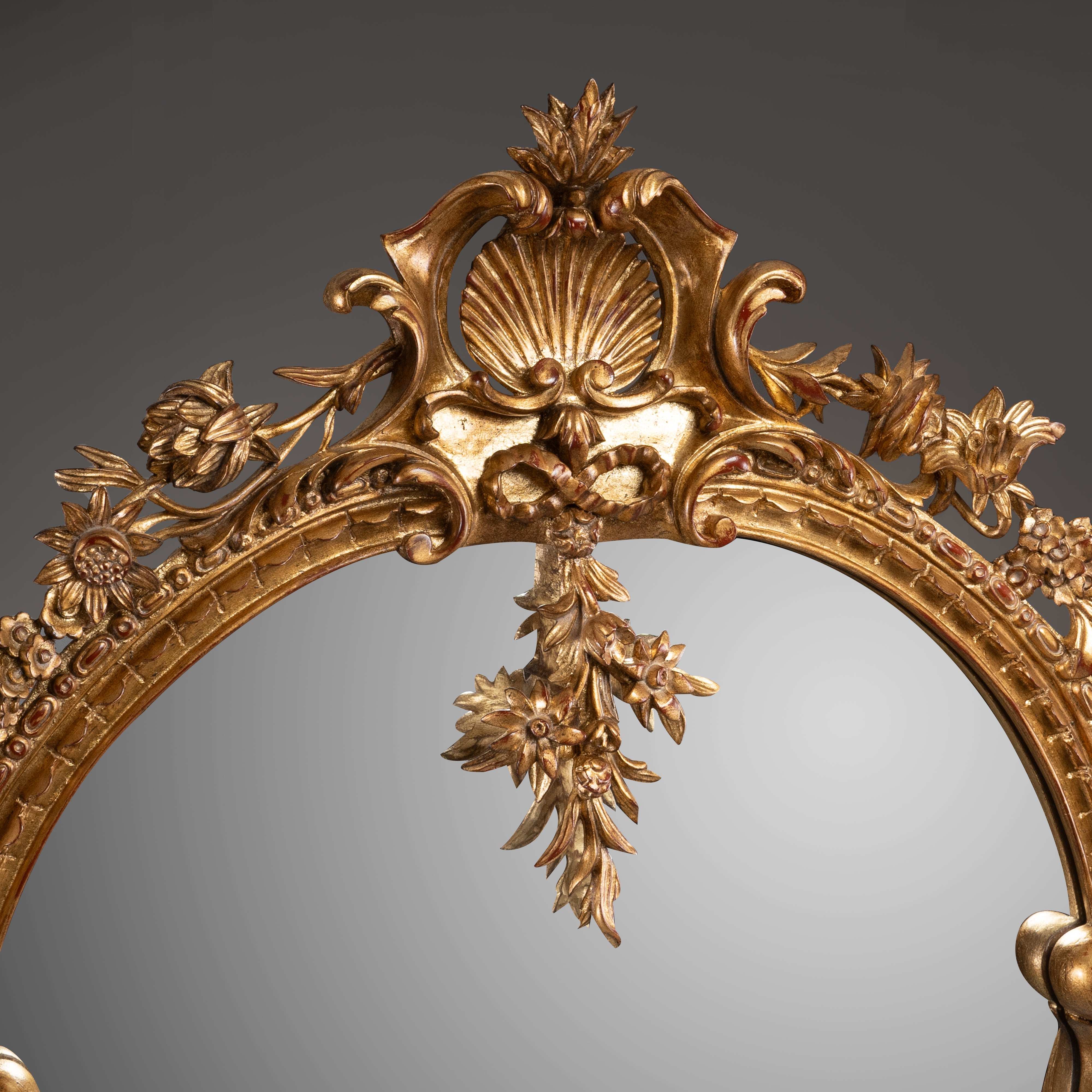 Rococo Style Giltwood Mirror with Floral and Scroll Motifs