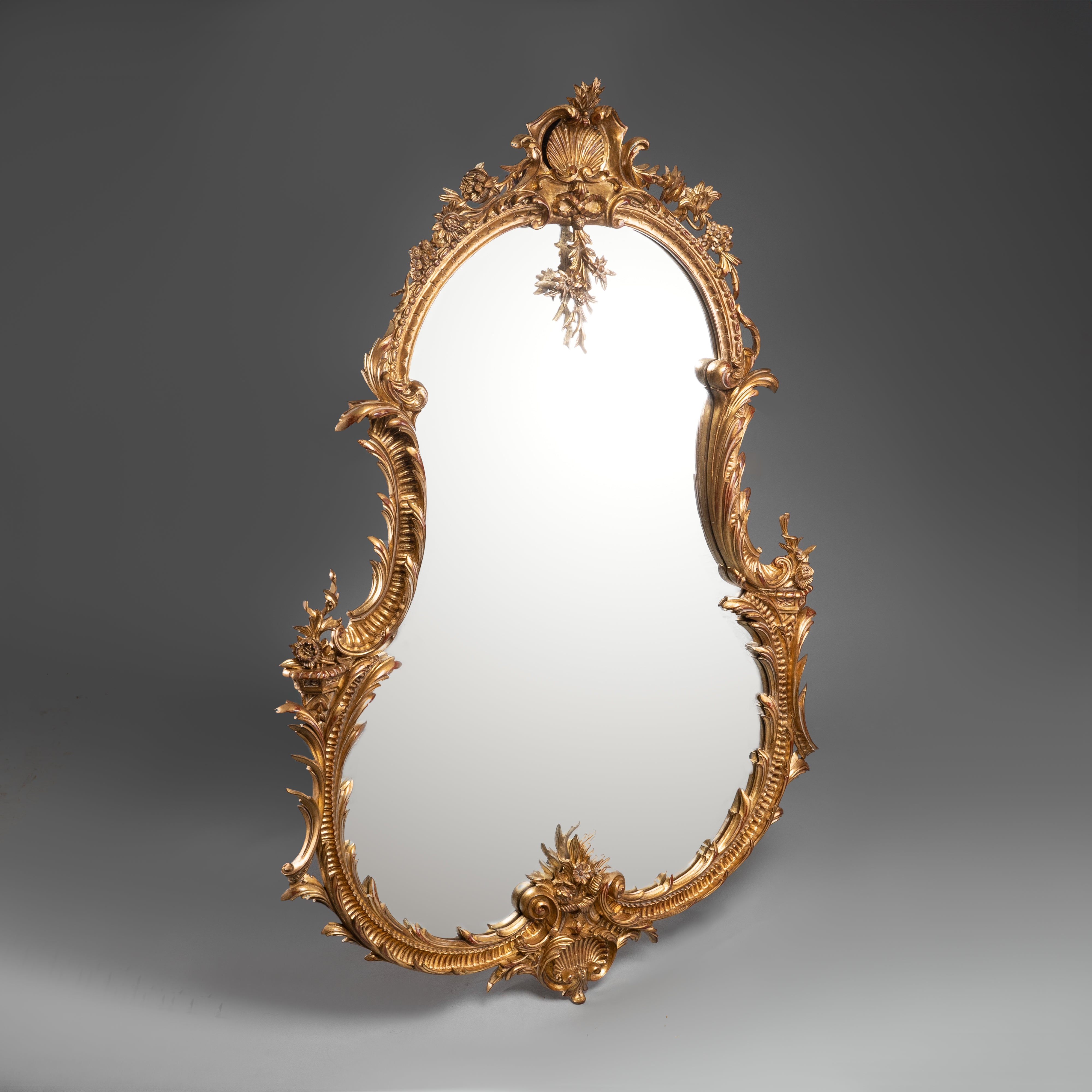 Rococo Style Giltwood Mirror with Floral and Scroll Motifs