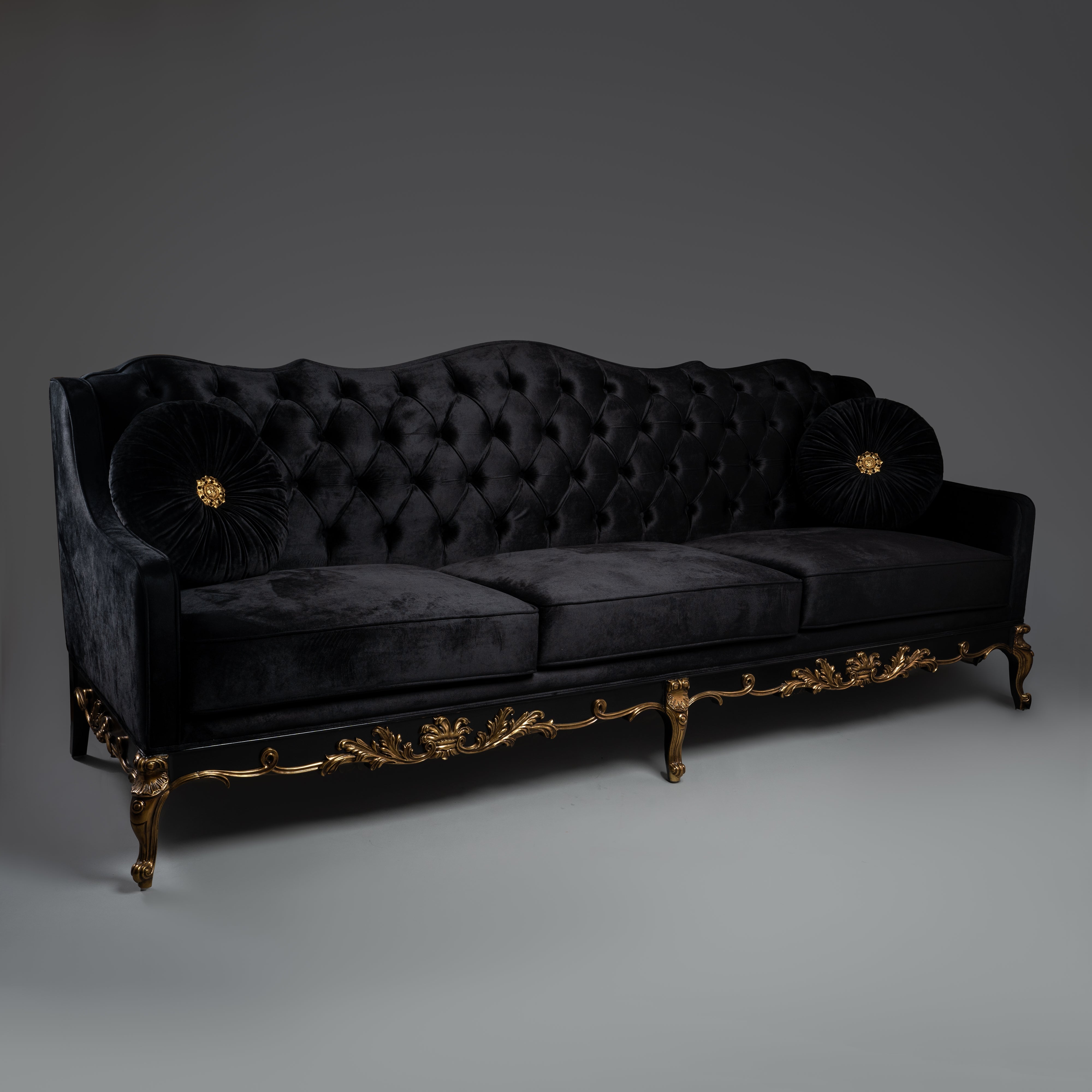 Black Velvet Tufted Sofa with Ornate Brass Detailing