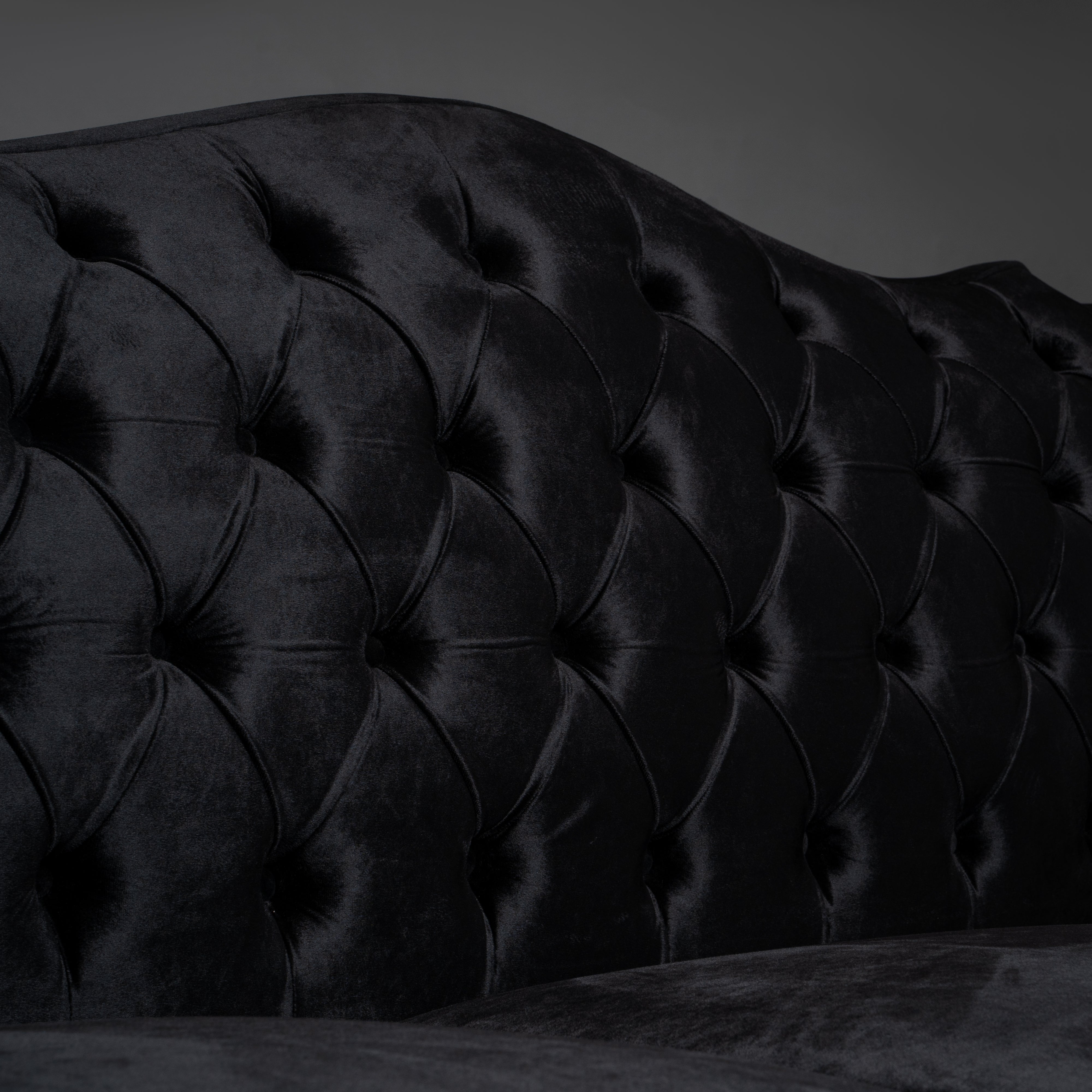 Black Velvet Tufted Sofa with Ornate Brass Detailing