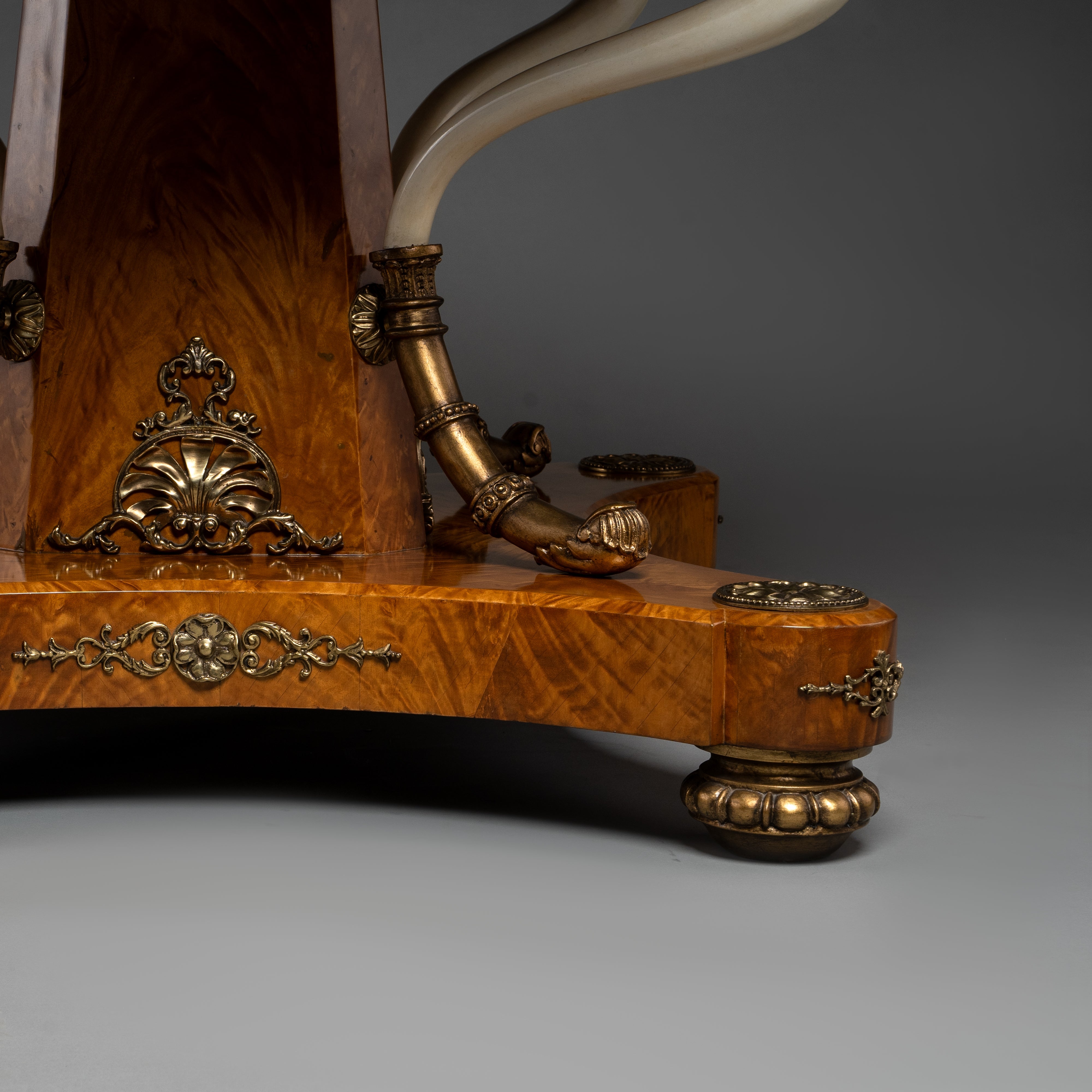 Regency Style Round Table with Inlaid Burl Wood and Ornate Brass Accents