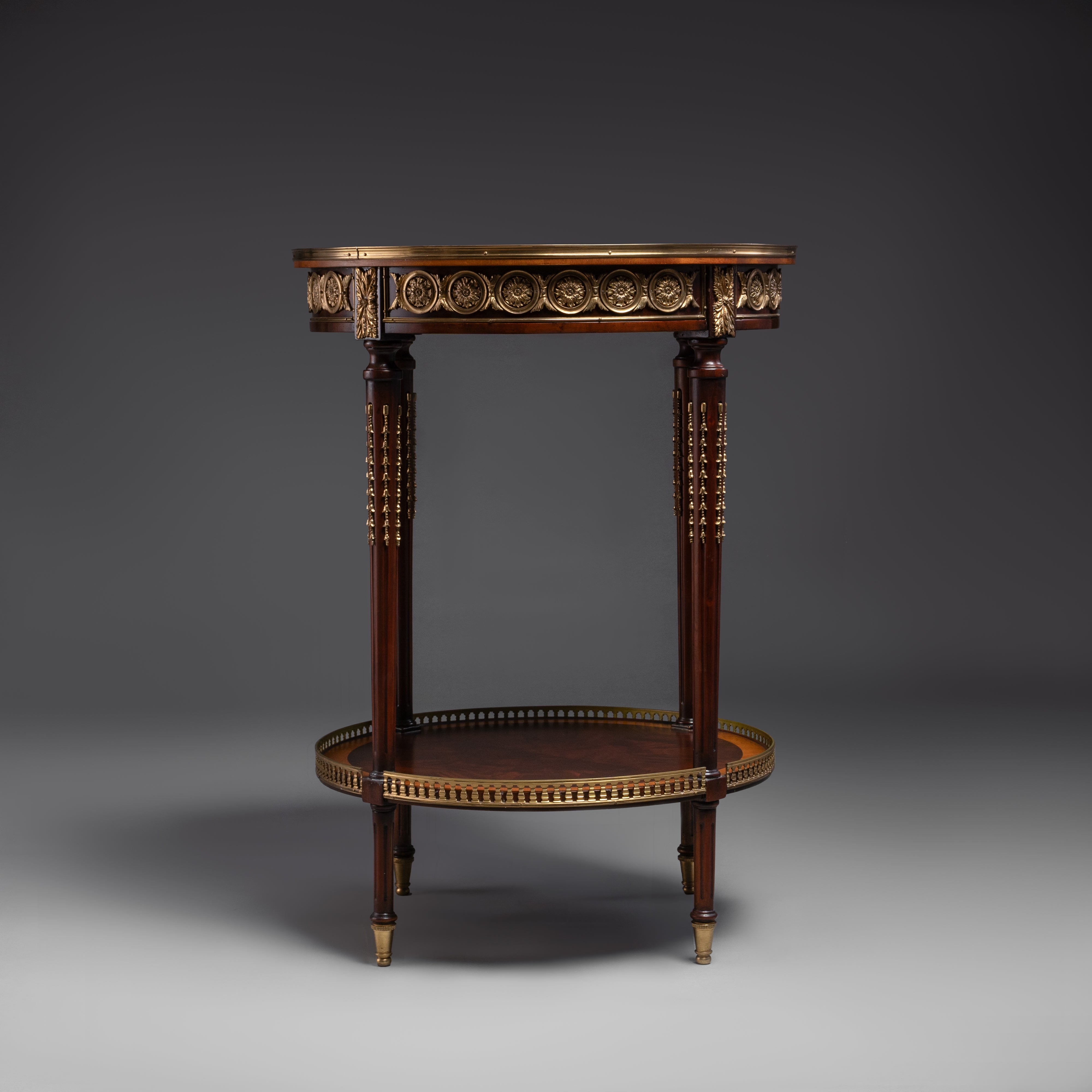 A luxurious round side table featuring  intricate veneer work, elegant brass accents,  and timeless craftsmanship.