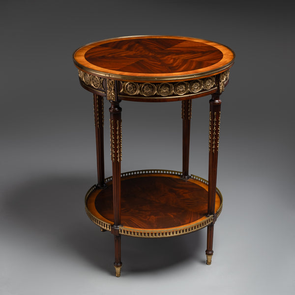 A luxurious round side table featuring  intricate veneer work, elegant brass accents,  and timeless craftsmanship.