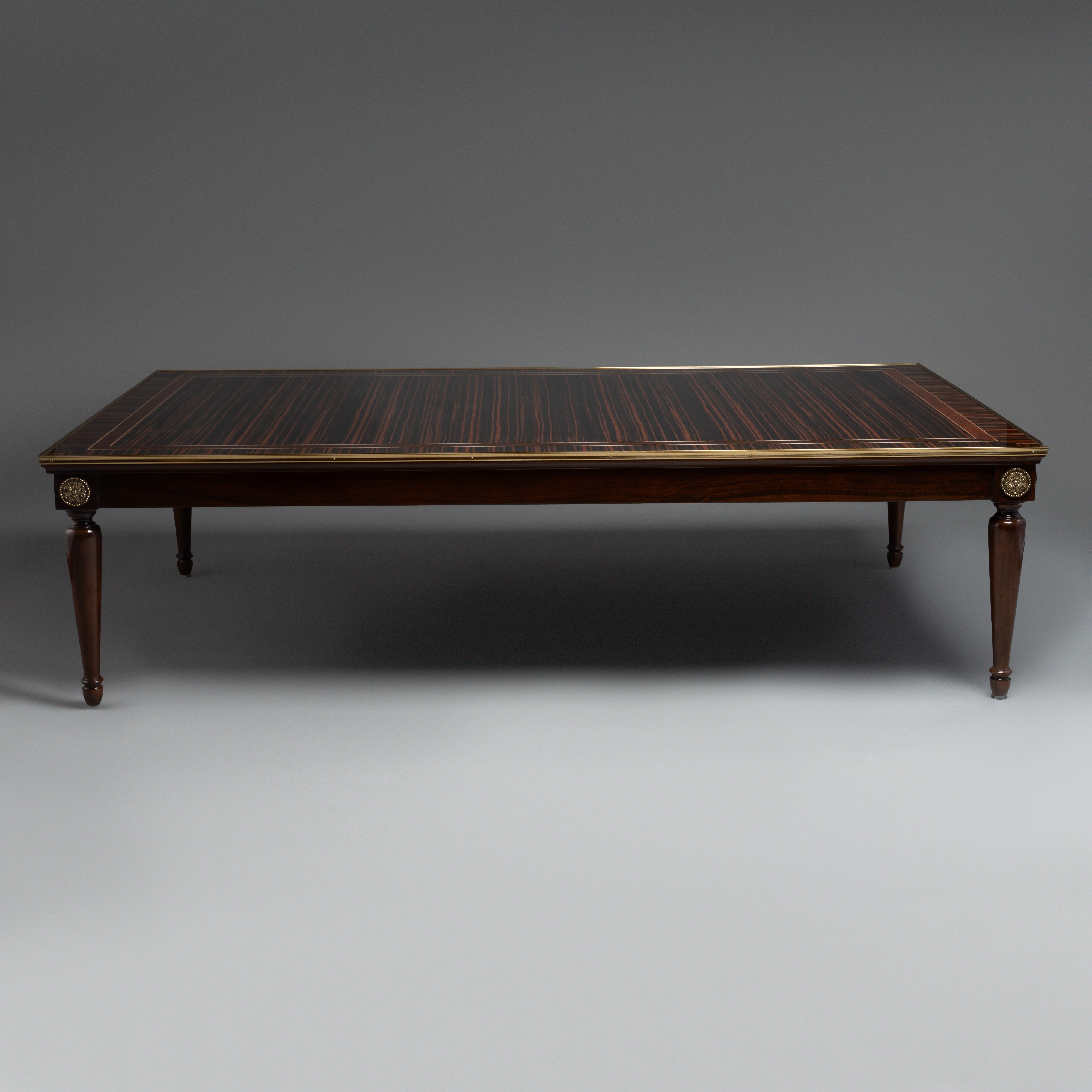 Elegant Coffee Table with Dark Wood Veneer,  Brass Inlay, and Tapered Legs