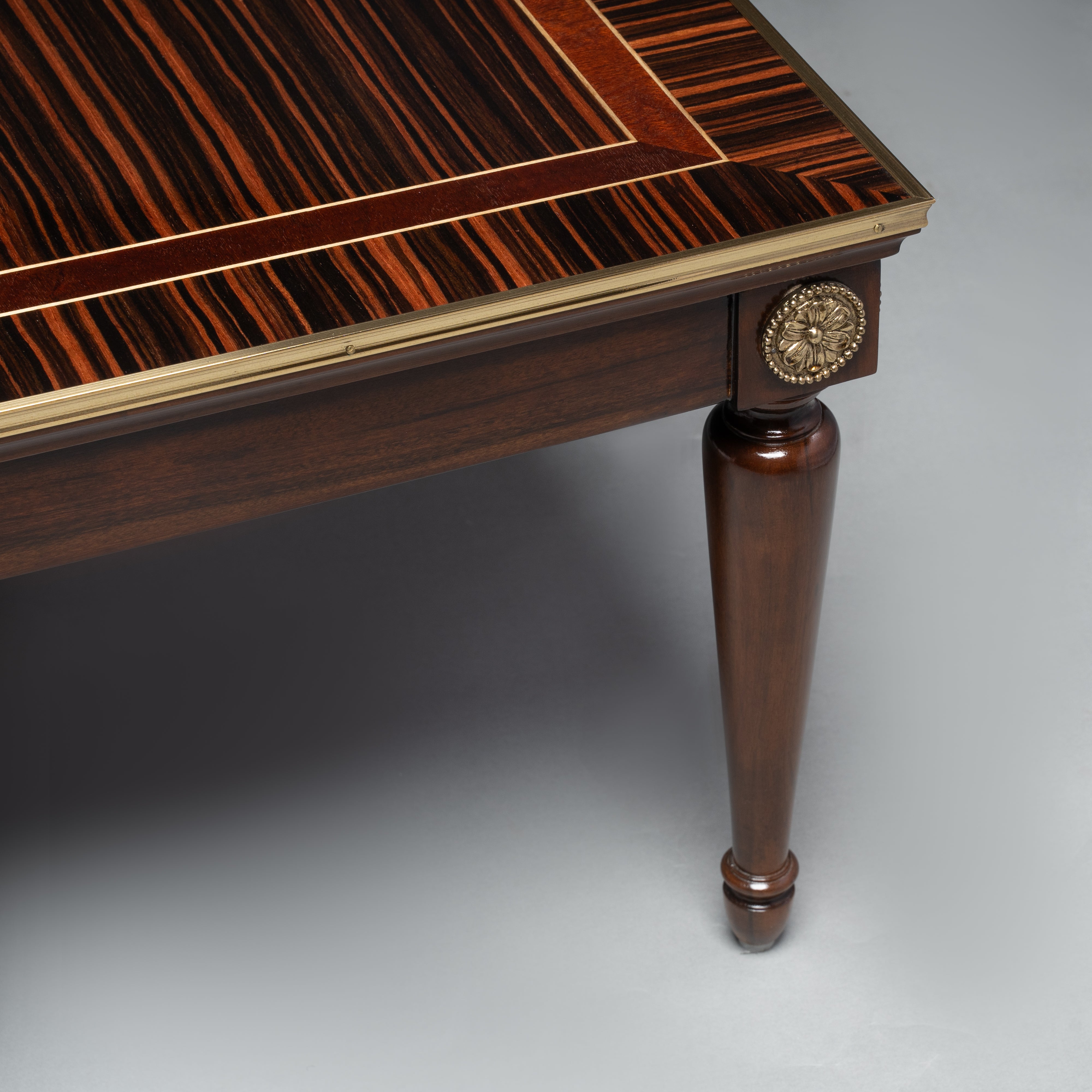 Elegant Coffee Table with Dark Wood Veneer,  Brass Inlay, and Tapered Legs