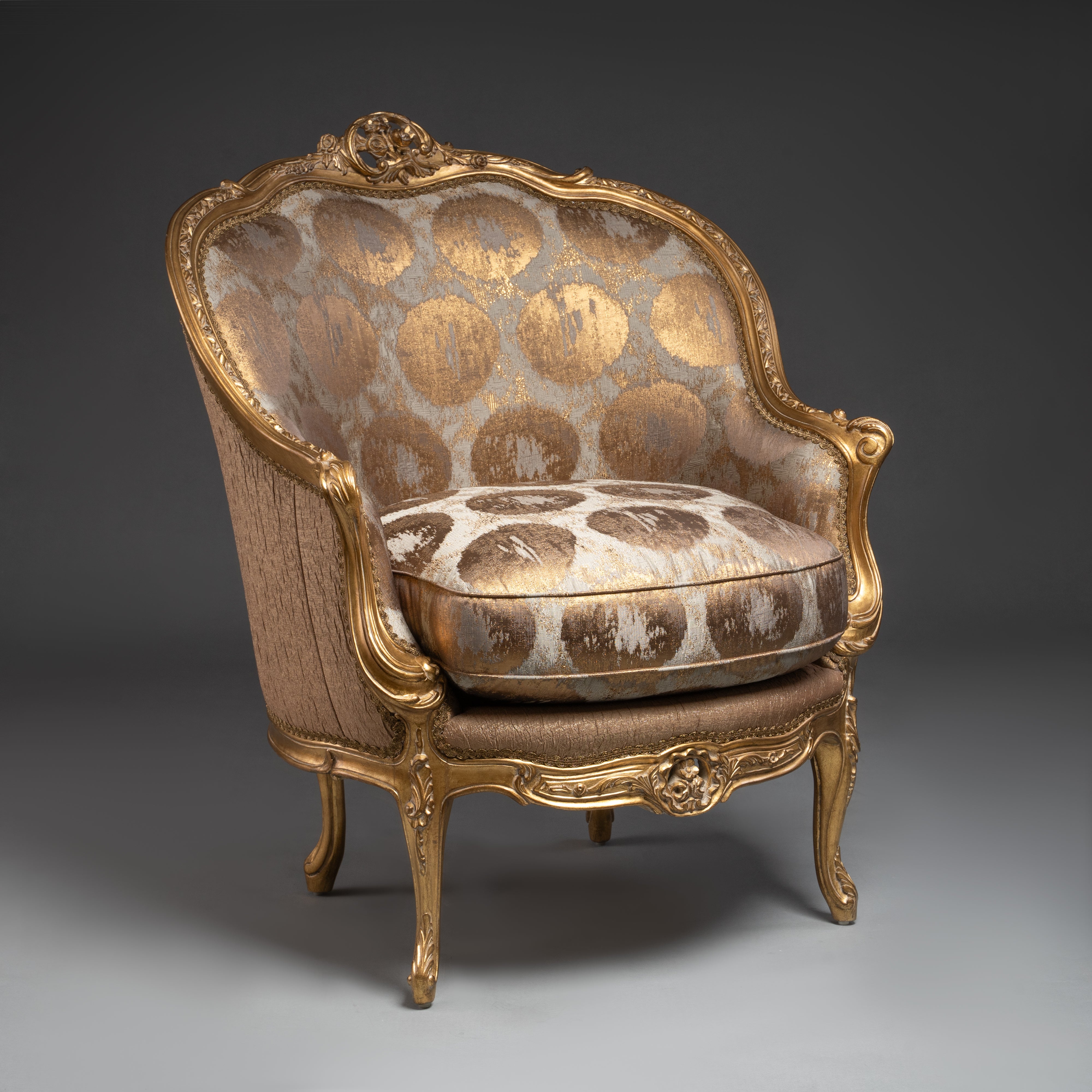 A lavishly upholstered Louis XV-style  armchair with gilded elegance