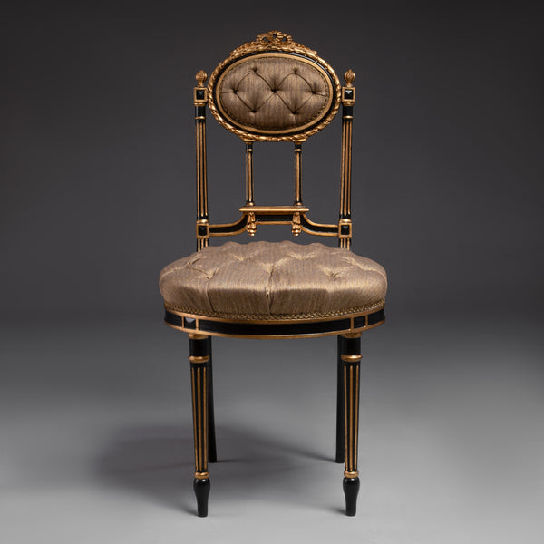 Opulent tufted chair with gilded accents and  regal charm.