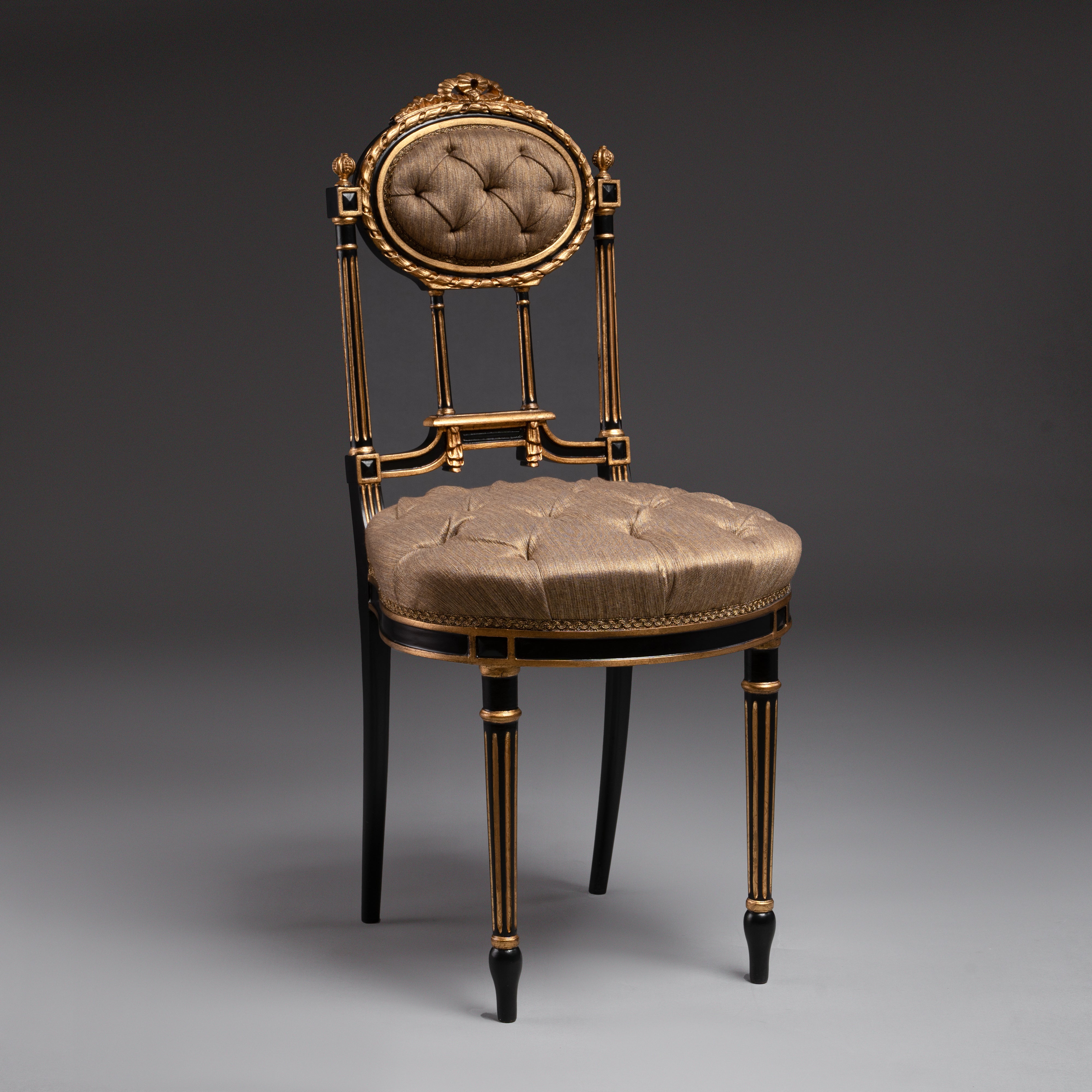Opulent tufted chair with gilded accents and  regal charm.