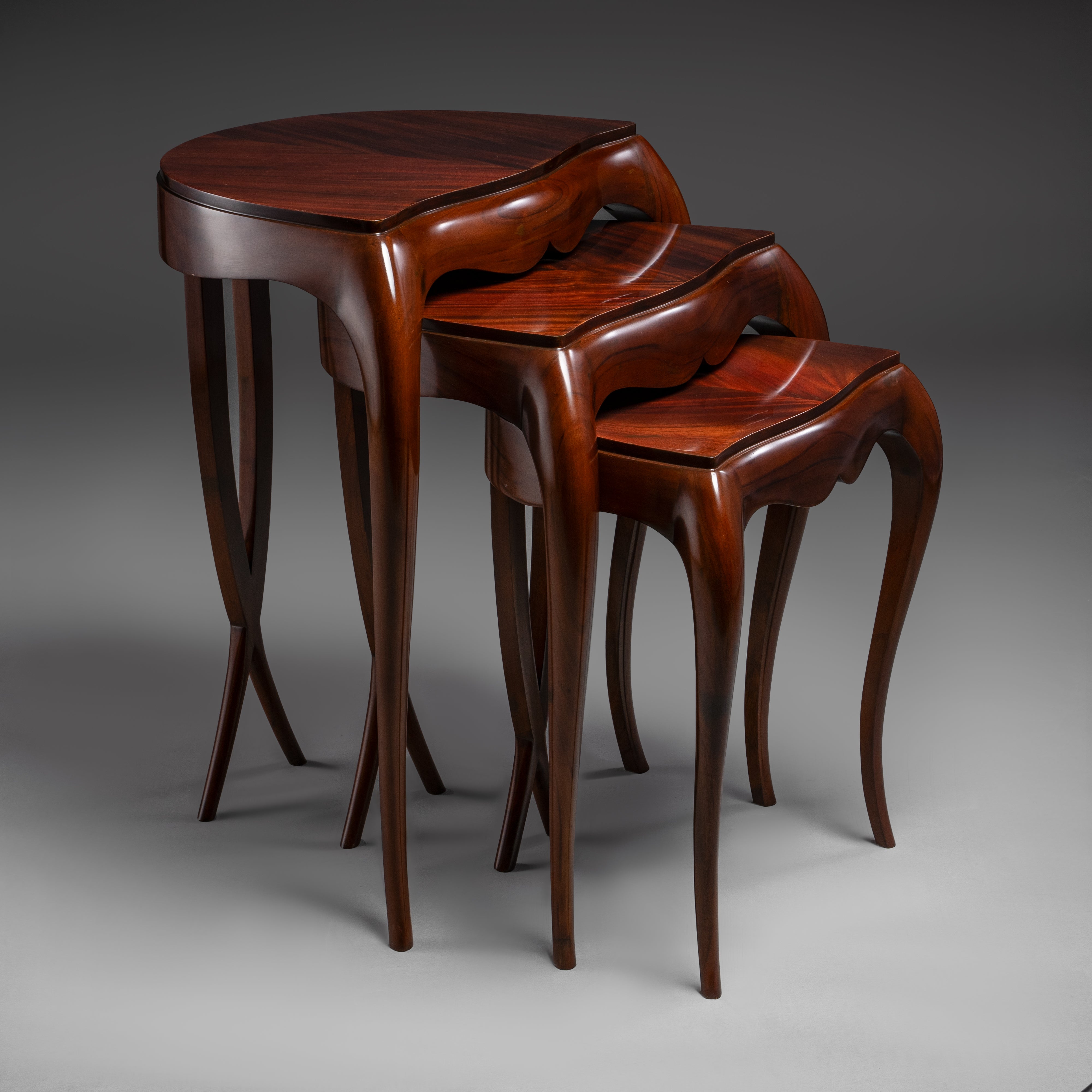 Exquisite Nesting Table Set with Flowing  Silhouette and Lustrous Finish