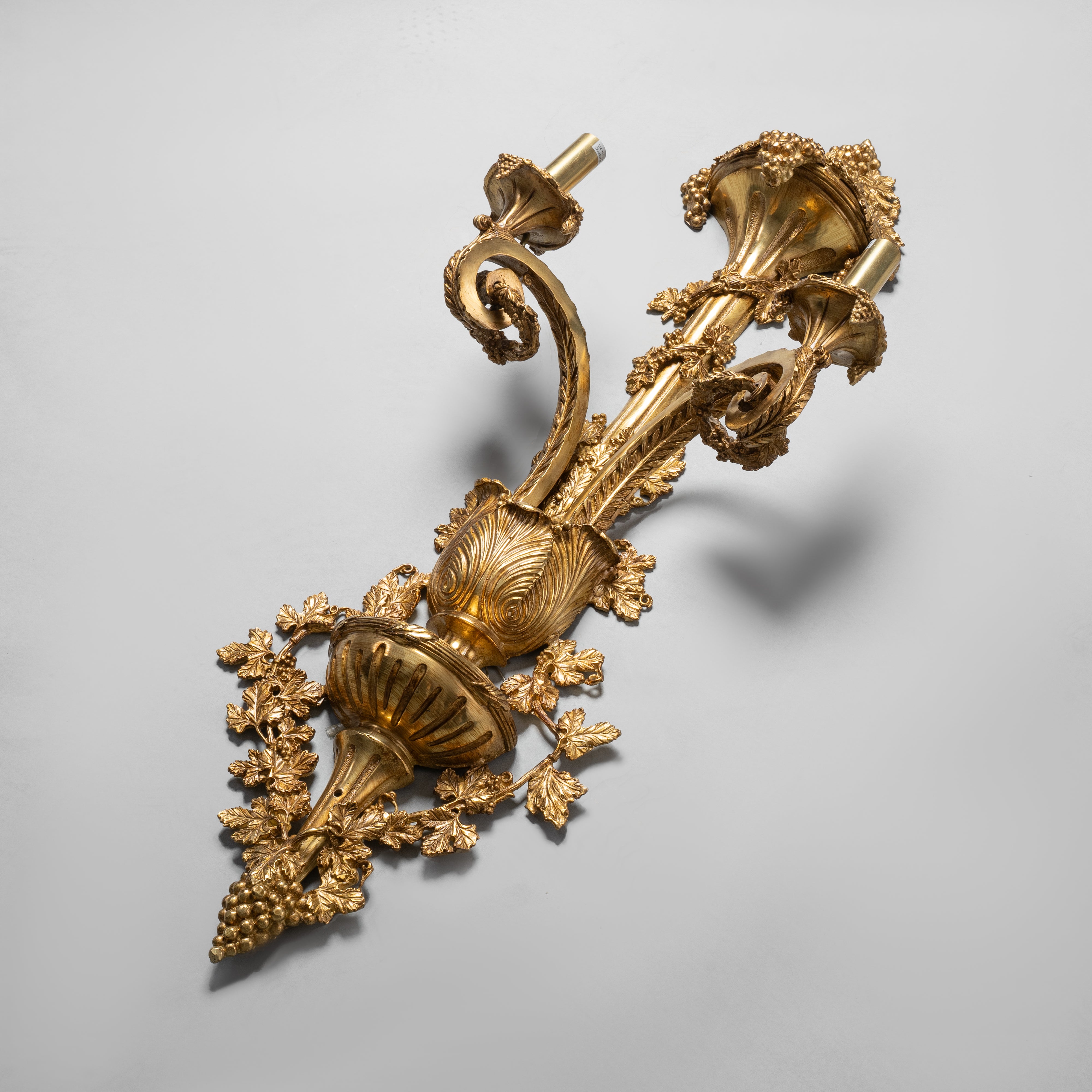 Ornate Louis XVI-style gilt bronze wall sconce  with intricate acanthus and floral motifs