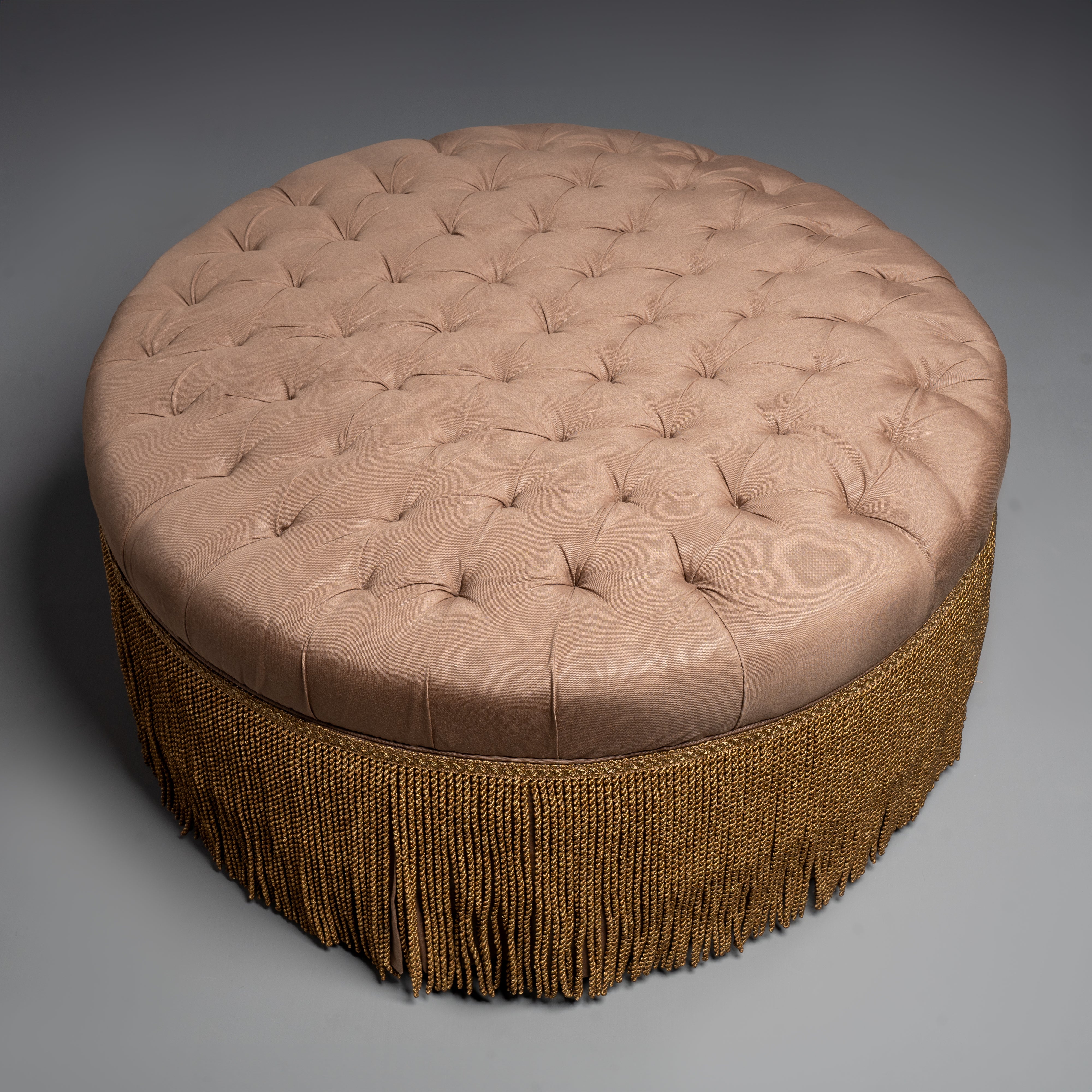 Luxurious Tufted Round Ottoman with  Elegant Fringe Detail