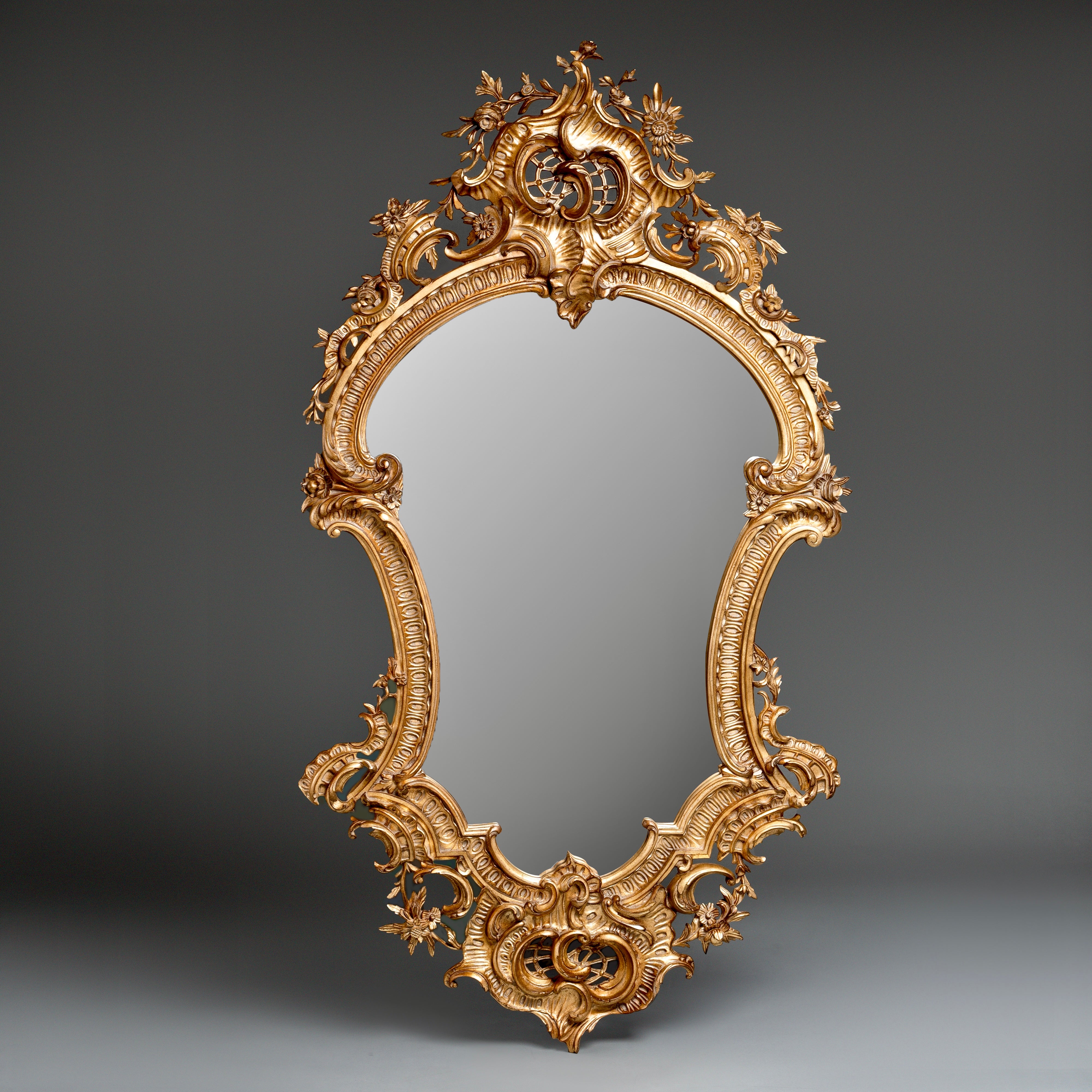Rococo-Style Ornate Gilded Mirror  with Floral and Scrollwork Detailing