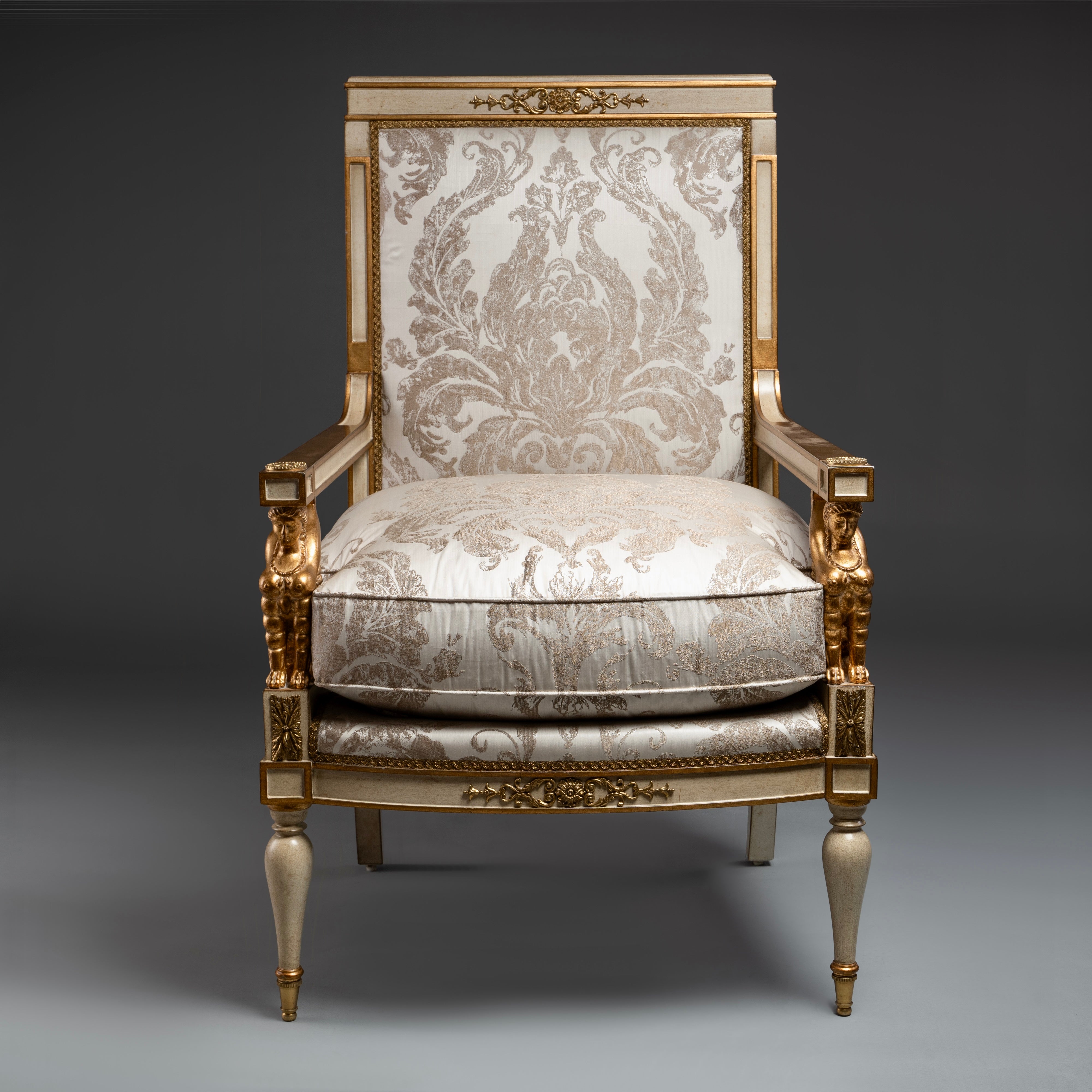 Louis XVI Style Armchair with Gilded Sphinx  Armrests and Ornate Upholstery