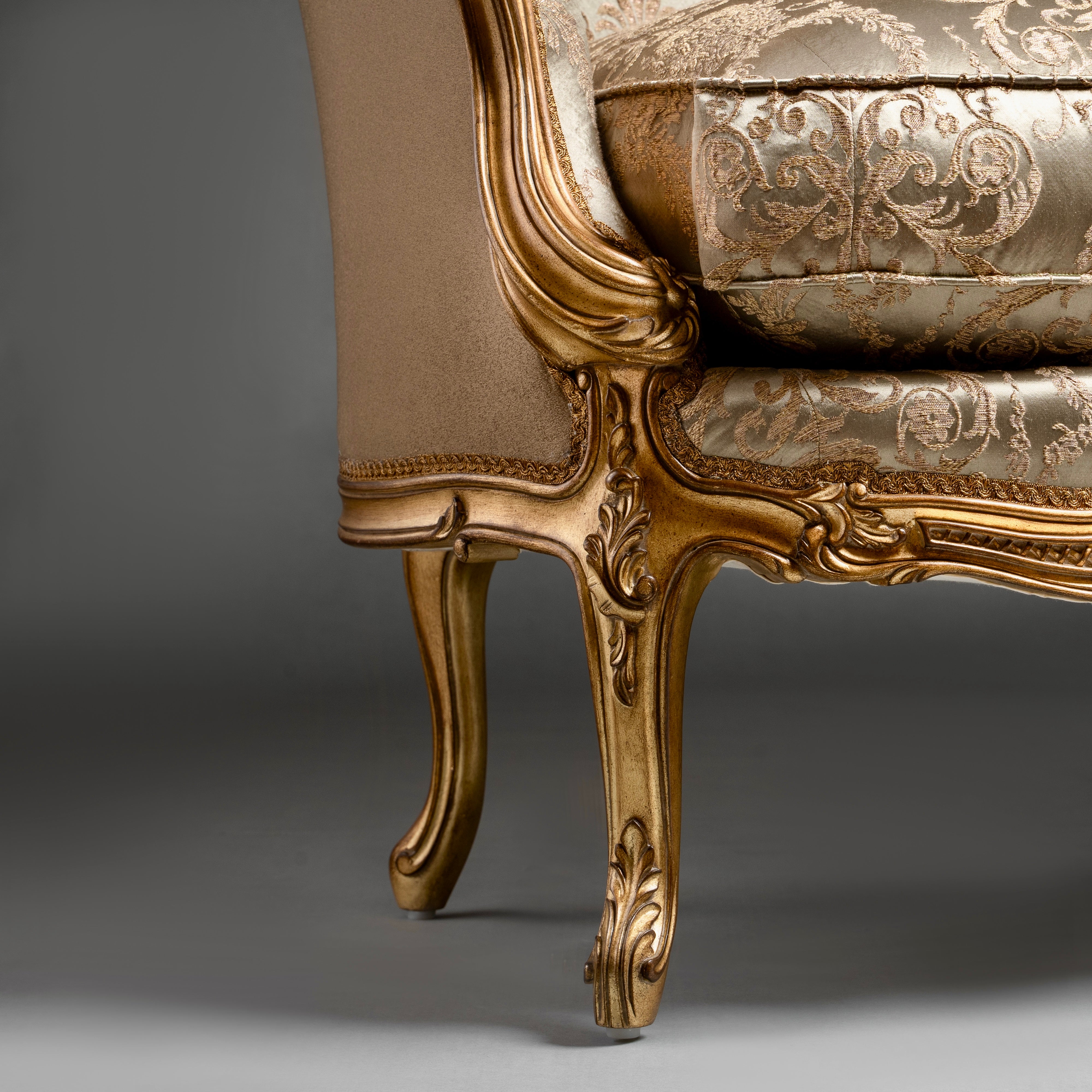 A timeless Chesterfield sofa with luxurious  tufted leather and elegantly rolled arms.