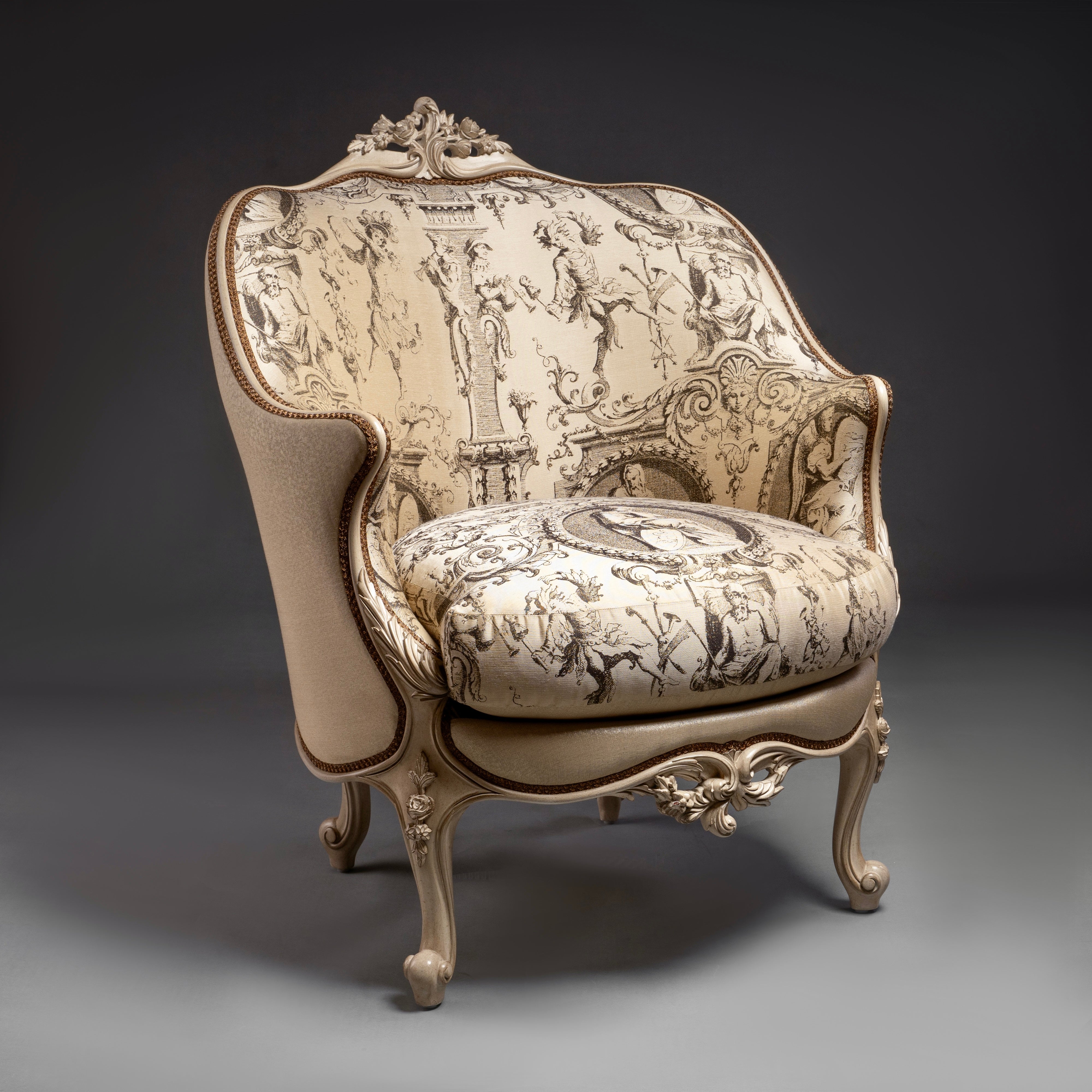 An exquisite Louis XV-style bergère with  intricate carvings and elegant toile de Jouy  upholstery.