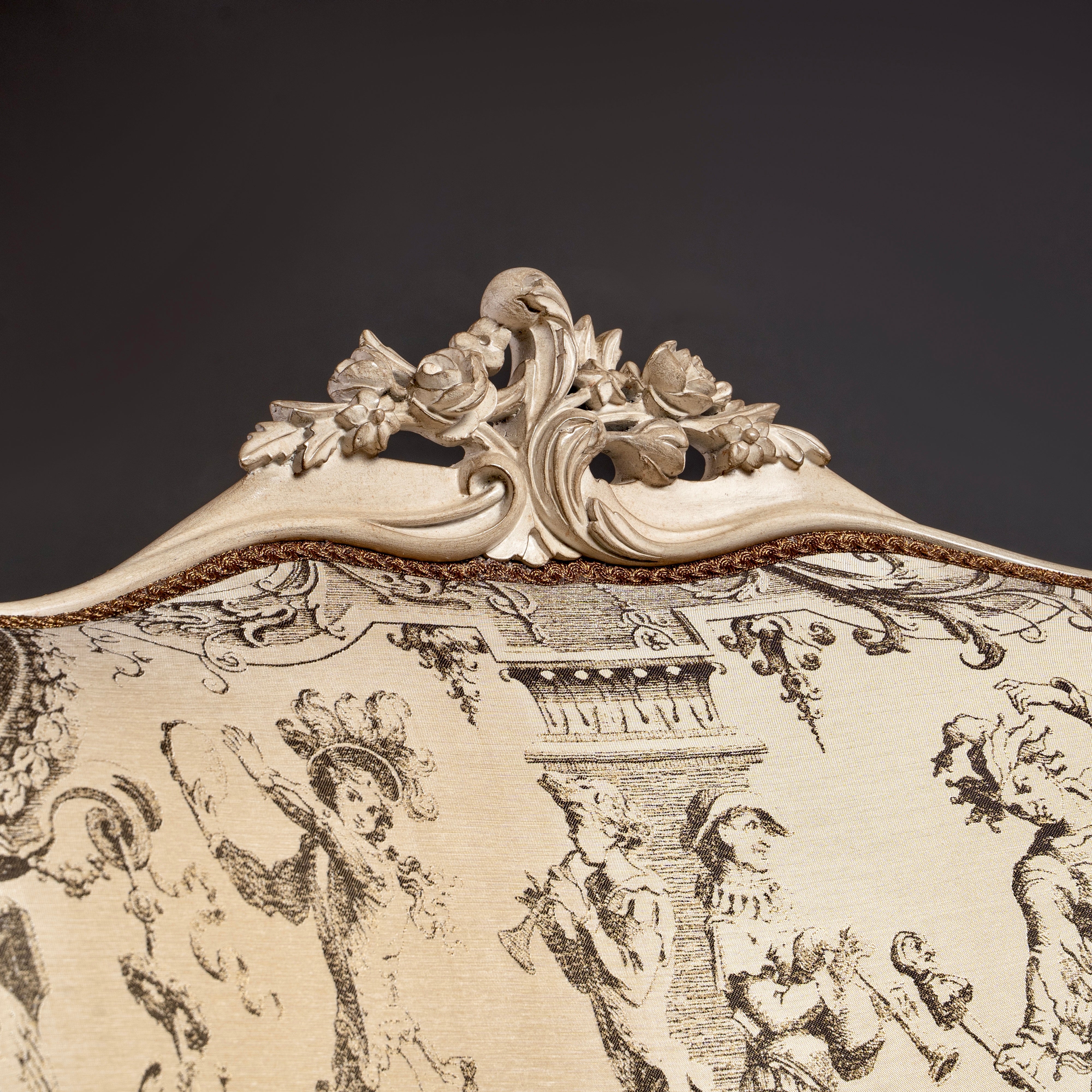 An exquisite Louis XV-style bergère with  intricate carvings and elegant toile de Jouy  upholstery.