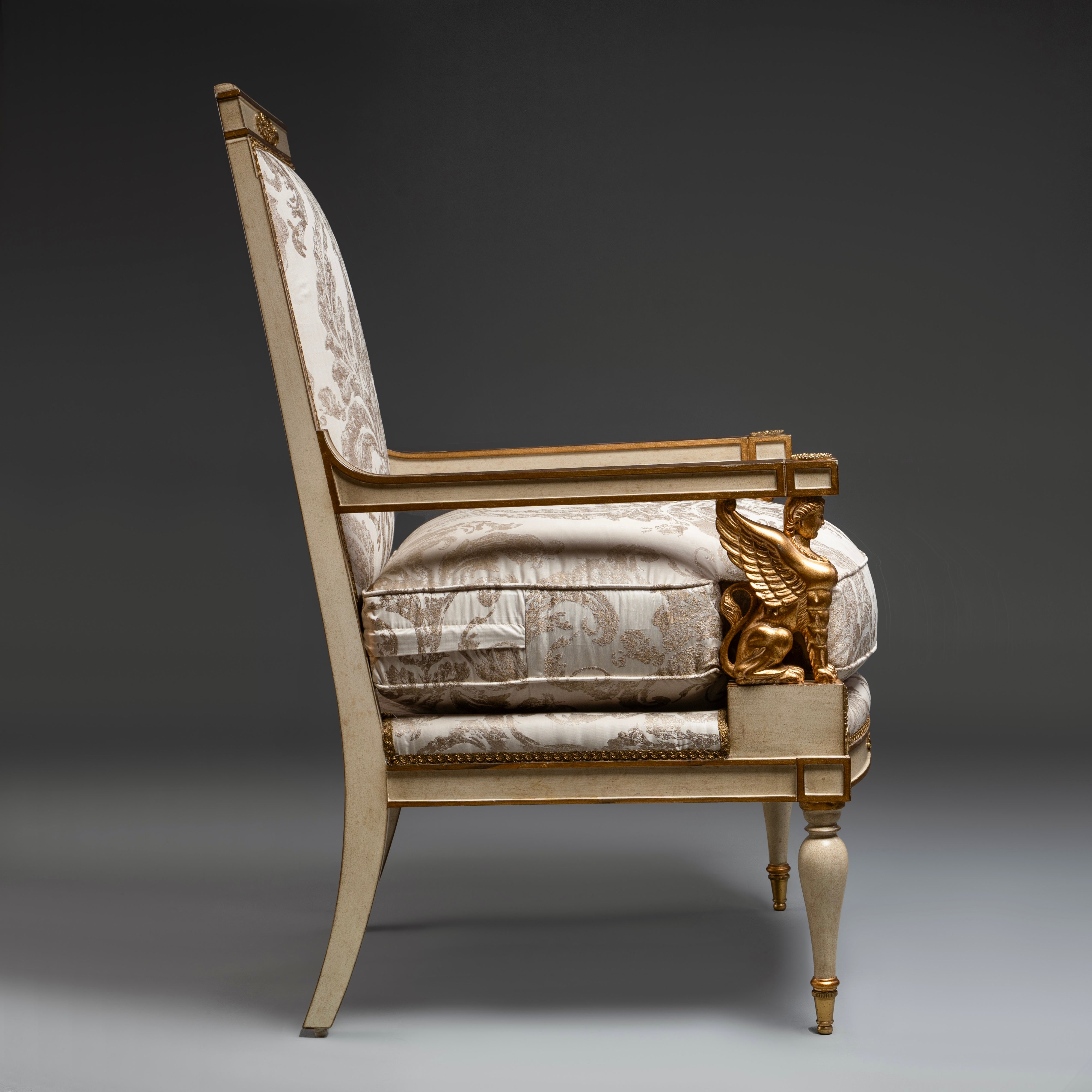 Louis XVI Style Armchair with Gilded Sphinx  Armrests and Ornate Upholstery