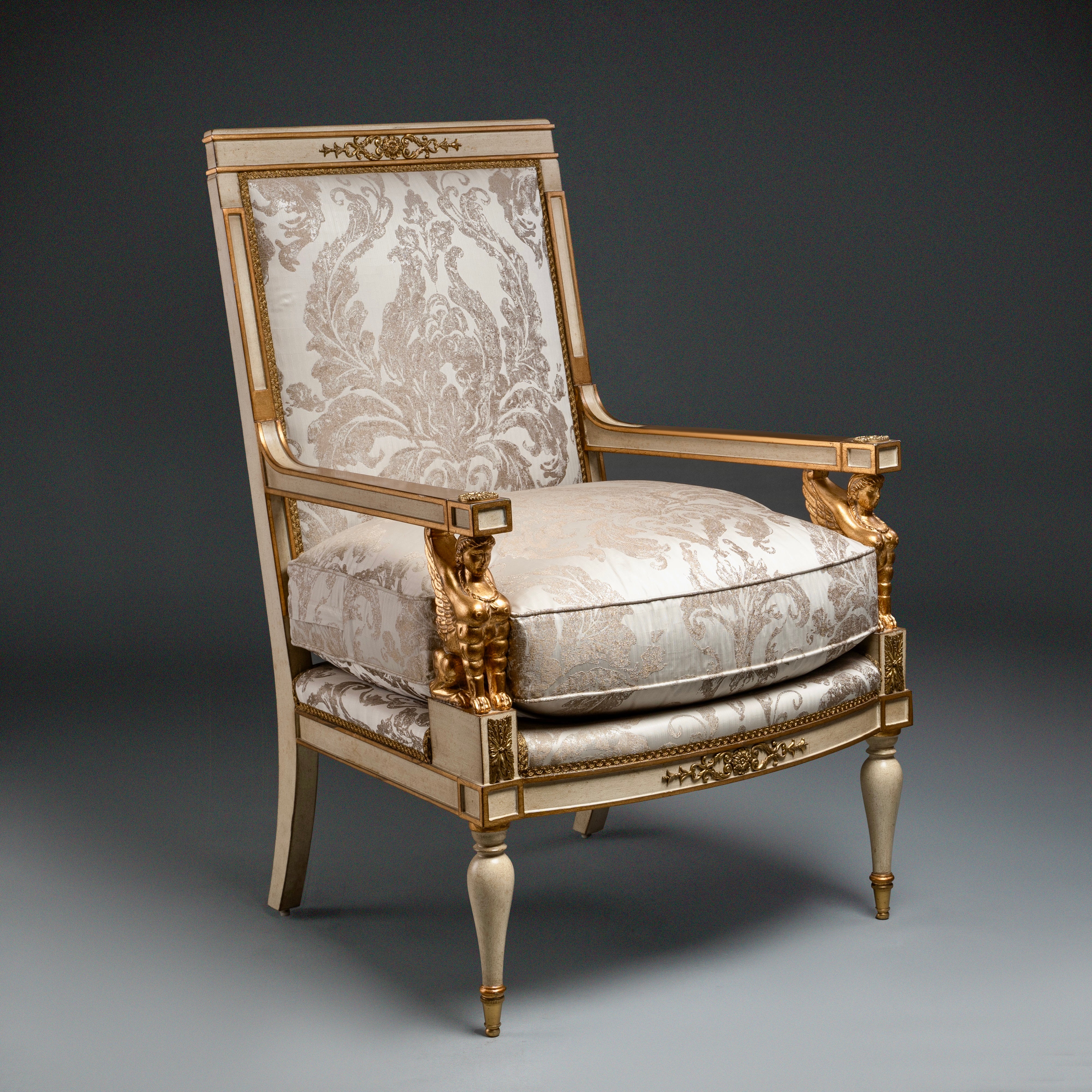 Louis XVI Style Armchair with Gilded Sphinx  Armrests and Ornate Upholstery